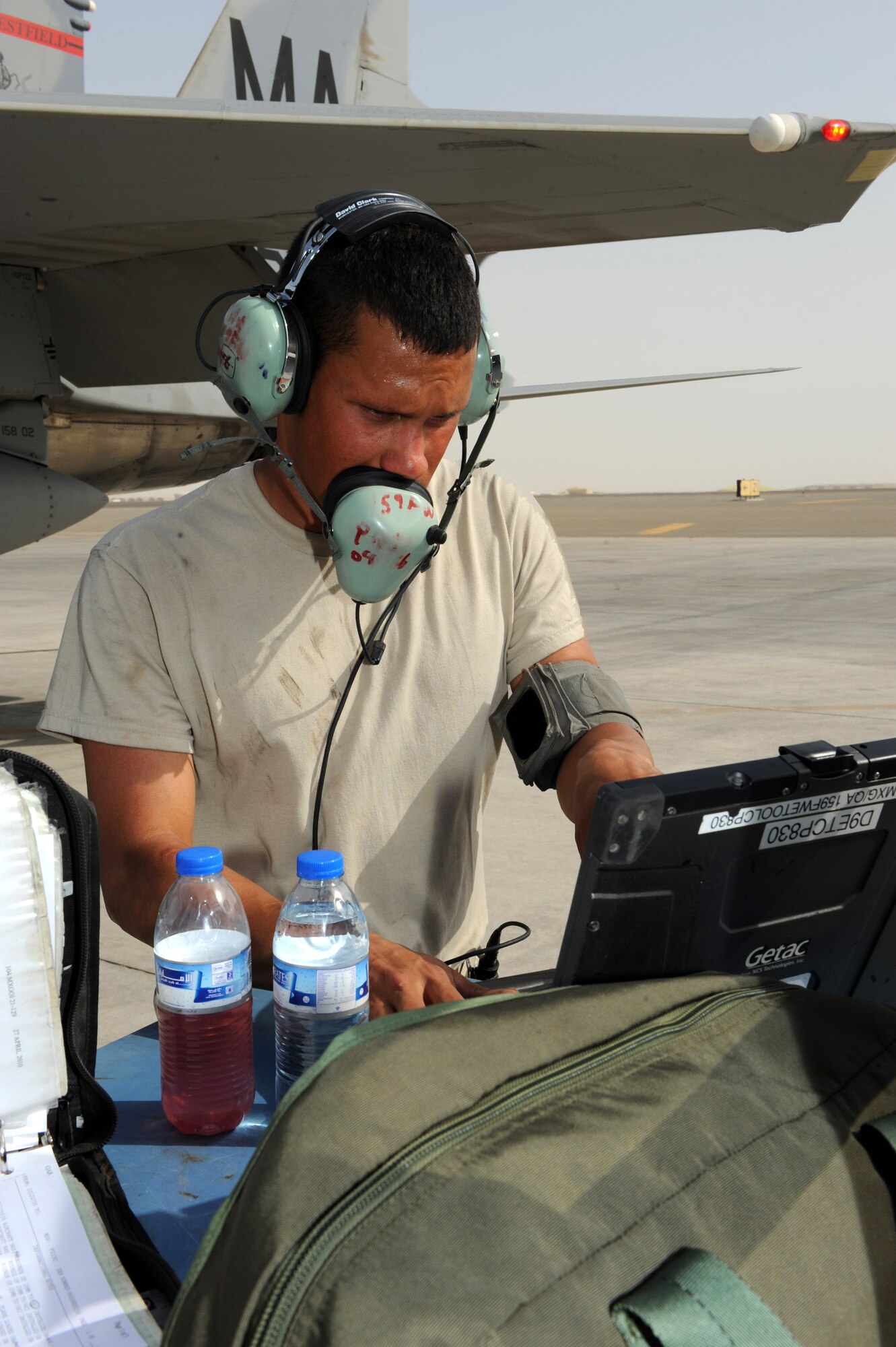 SOUTHWEST ASIA - U.S. Air Force Staff Sgt. Pedro Acevedo, 380th Expeditionary Aircraft Maintenance Squadron crew chief, reads his checklist from a laptop computer July 30, 2012. Acevedo, a Pearl River, La., native, is a member of the Louisiana Air National Guard. (U.S. Air Force photo/Master Sgt. Scott MacKay)