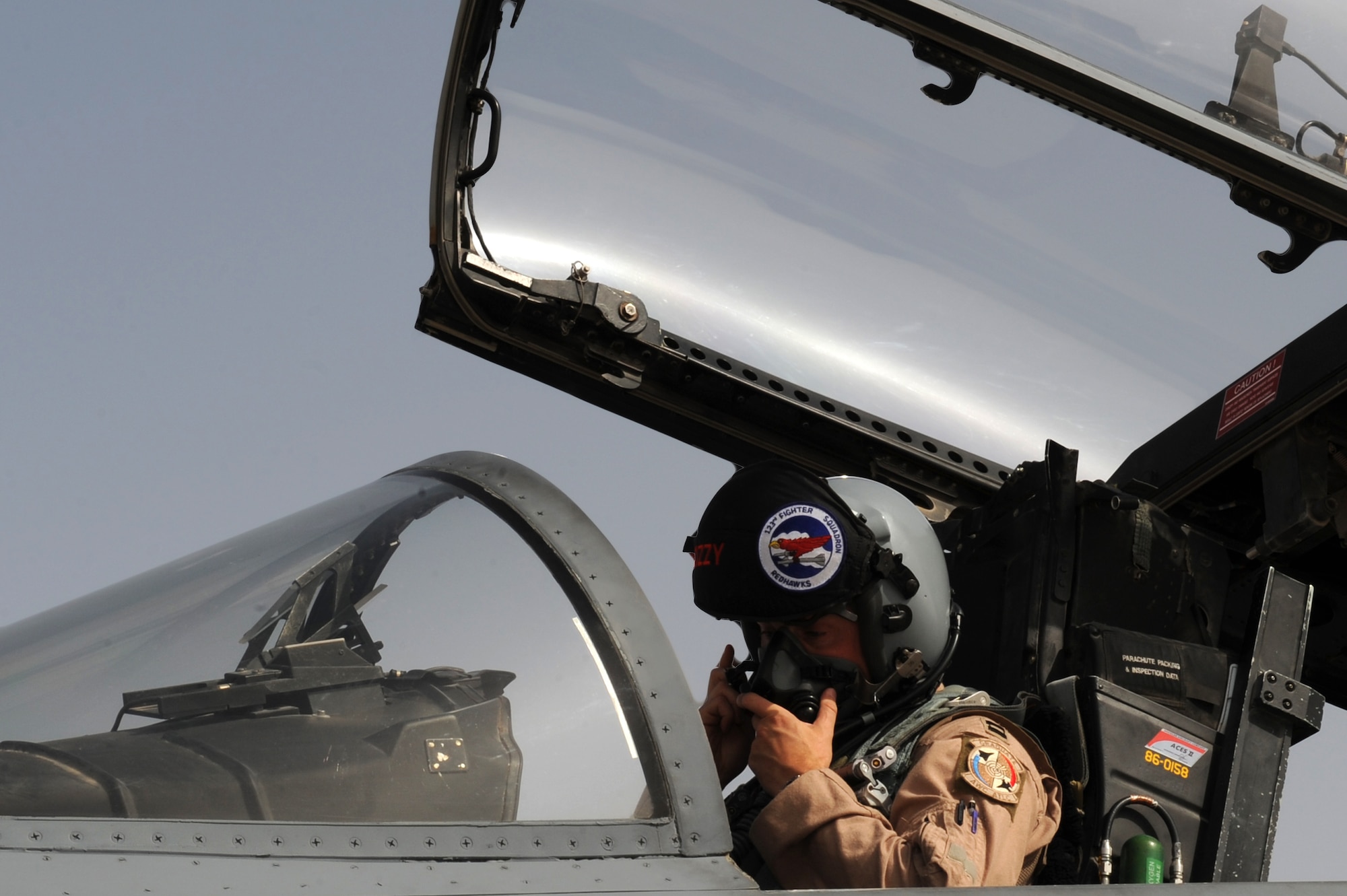 SOUTHWEST ASIA -U.S. Air Force Capt. Jeffrey Yeates, 123rd Fighter Squadron pilot, puts his mask on before takeoff July 30, 2012. Yeates, a Vancouver, Wash., native, is a member of the Oregon Air National Guard and is deployed in support of the 122nd Expeditionary Fighter Squadron. (U.S. Air Force photo/Master Sgt. Scott MacKay)