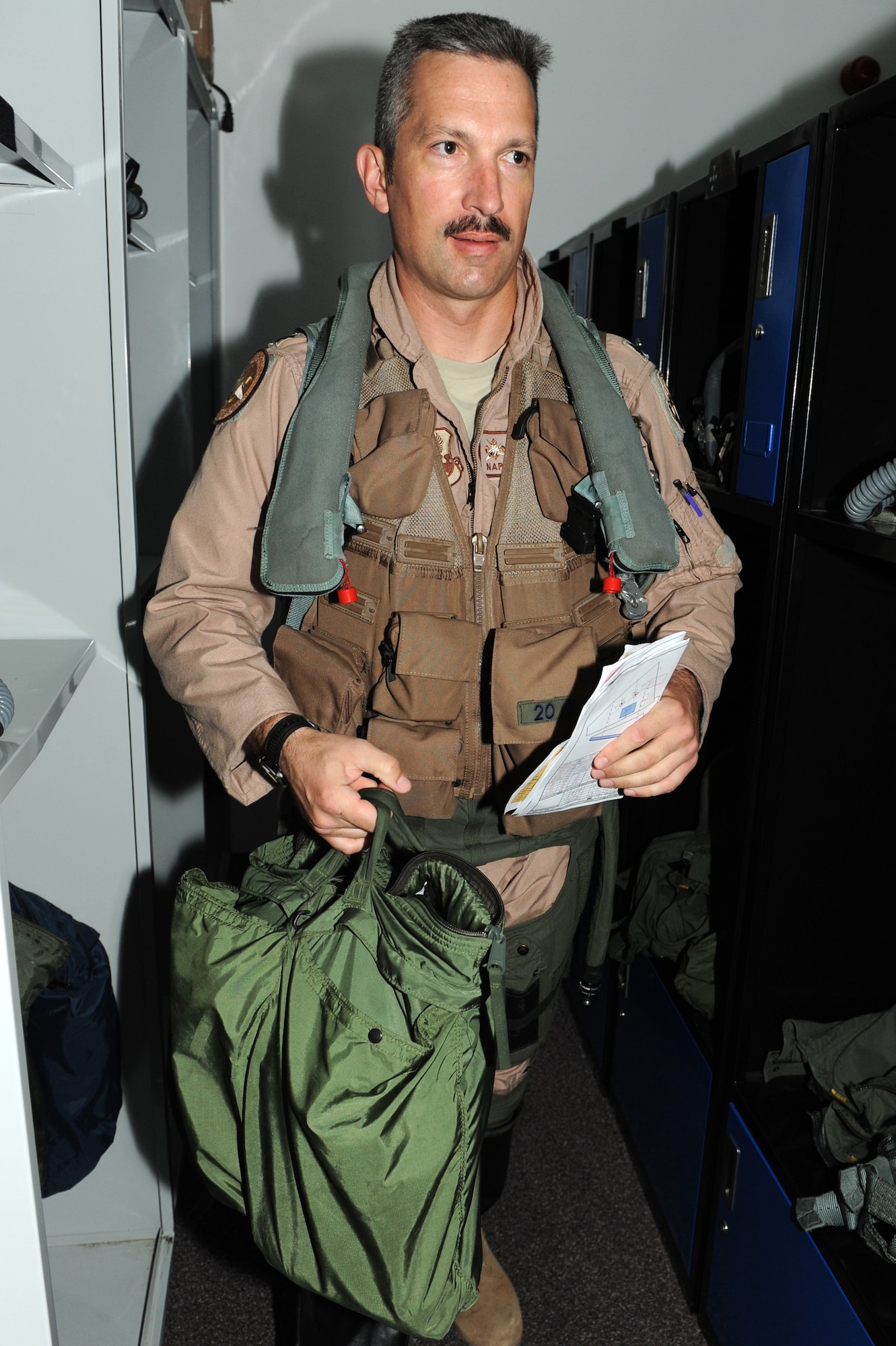 SOUTHWEST ASIA - U.S. Air Force Lt. Col. Jacen Keller, 122nd Expeditionary Fighter Squadron pilot, gears up before his flight July 30, 2012. Keller, a New Orleans native, is a member of the Louisiana Air National Guard. (U.S. Air Force photo/Master Sgt. Scott MacKay)