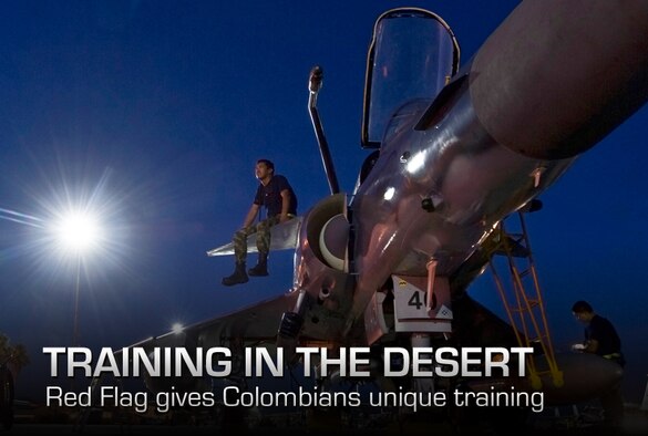 Colombian air force Tech Sgt. Javier Gomez, electronic specialist, sits on the wing of a Krif before the pilots come for pre-flight inspections during Red Flag 12-4 night training mission on July 24, 2012, at Nellis Air Force Base, Nev. Red Flag is a realistic combat training exercise involving the air forces of the United States and its allies. (U.S. Air Force photo/Airman 1st Class Daniel Hughes) 