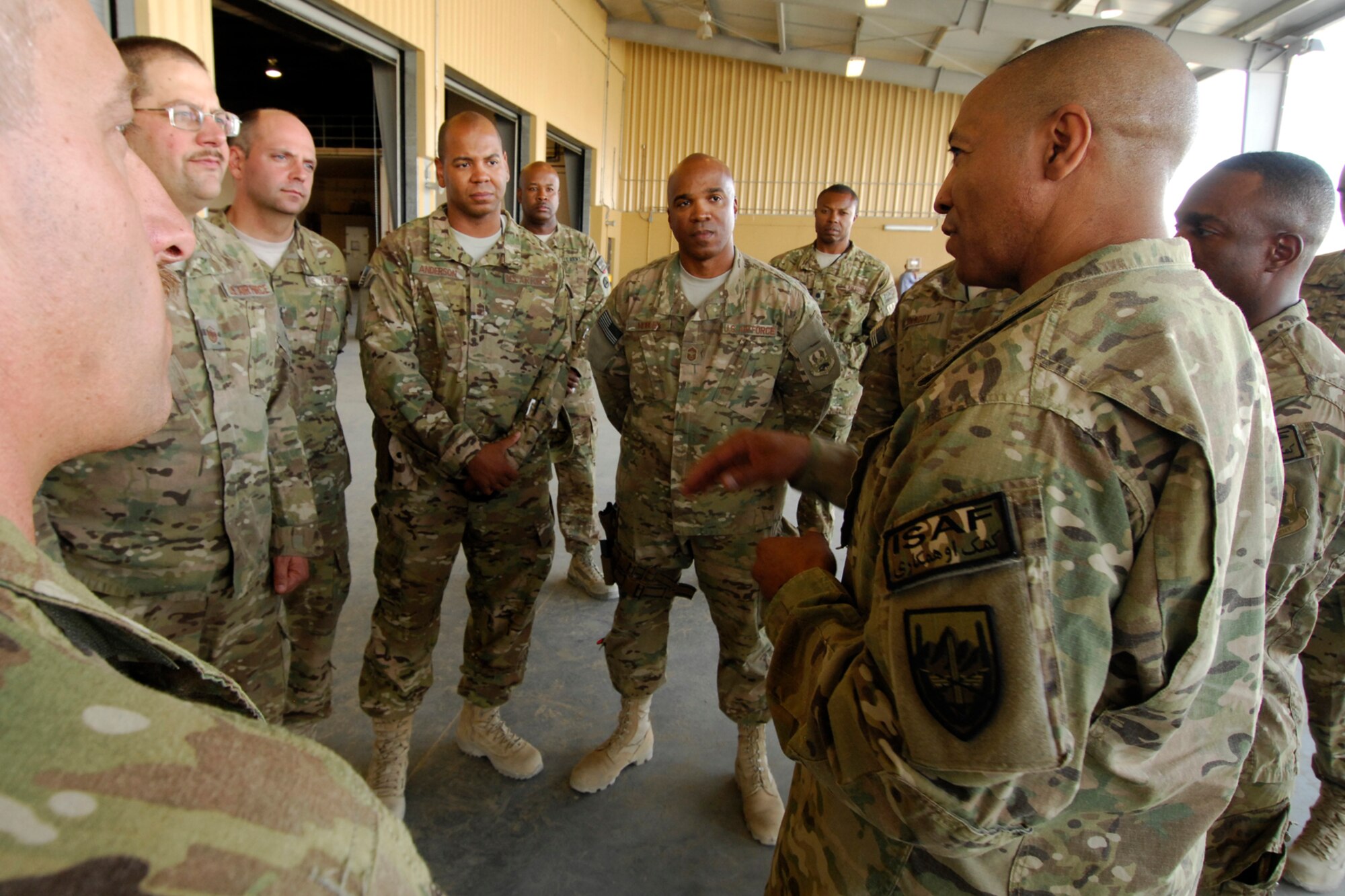 Command Sgt. Maj. Thomas Capel (right), International Security Assistance Force senior enlisted advisor, speaks with Airmen of the 455th Expeditionary Aerial Port Squadron during his visit to Bagram Airfield, Afghanistan, July 27, 2012. Capel spoke to Airmen about future operations and thanked them for their contributions in support of ongoing missions in Afghanistan. (U.S. Air Force photo/SSgt Jeff Nevison)