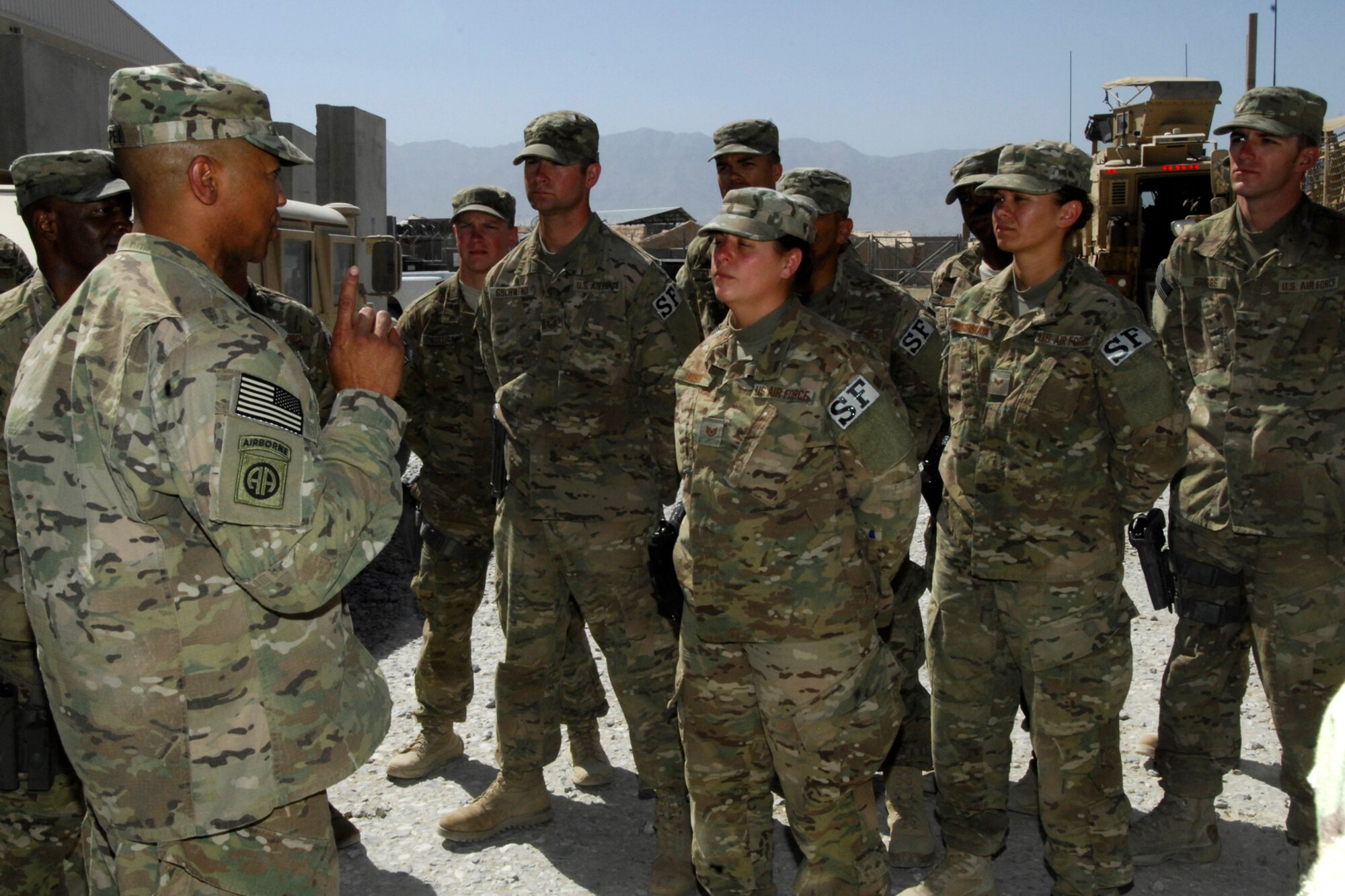 Command Sgt. Maj. Thomas Capel (left), International Security Assistance Force senior enlisted advisor, speaks with members of the 455th Expeditionary Security Forces Squadron during his visit to Bagram Airfield, Afghanistan, July 27, 2012. Capel spoke to Airmen about future operations and thanked them for their contributions in support of ongoing missions in Afghanistan. (U.S. Air Force photo/SSgt Jeff Nevison)
