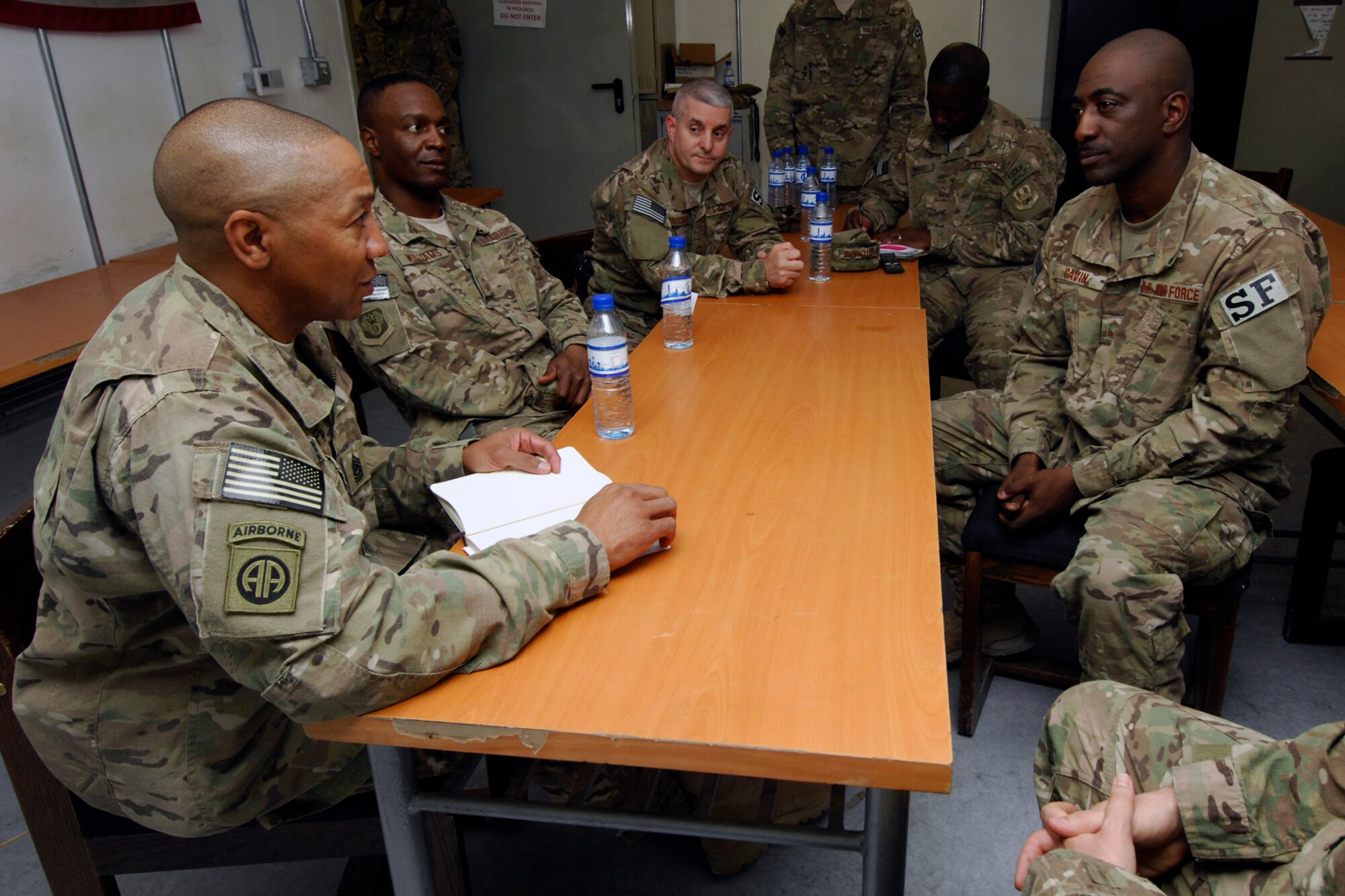 Command Sgt. Maj. Thomas Capel (left), International Security Assistance Force senior enlisted advisor, and other senior enlisted leaders, speak with Airmen of the 455th Expeditionary Security Forces Squadron during his visit to Bagram Airfield, Afghanistan, July 27, 2012. Capel spoke to Airmen about future operations and thanked them for their contributions in support of ongoing missions in Afghanistan. (U.S. Air Force photo/SSgt Jeff Nevison)