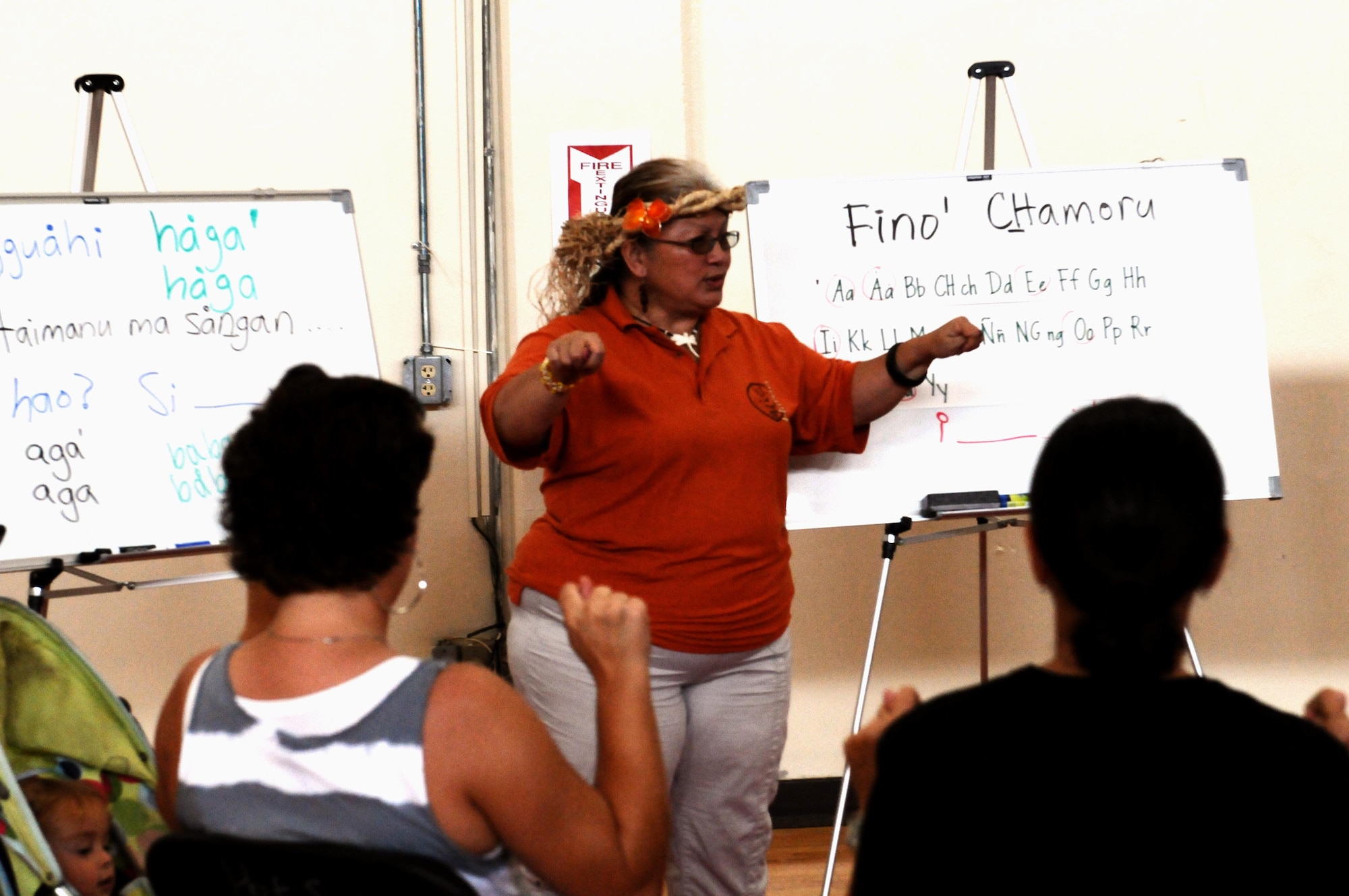 Members of Team Andersen participate in a basic Chamoru language lesson at the Chamoru Cultural Festival here July 28. The festival was a culture-sharing experience between military members and the people of Guam. (U.S. Air Force photo/Airman 1st Class Mariah Haddenham/Released)