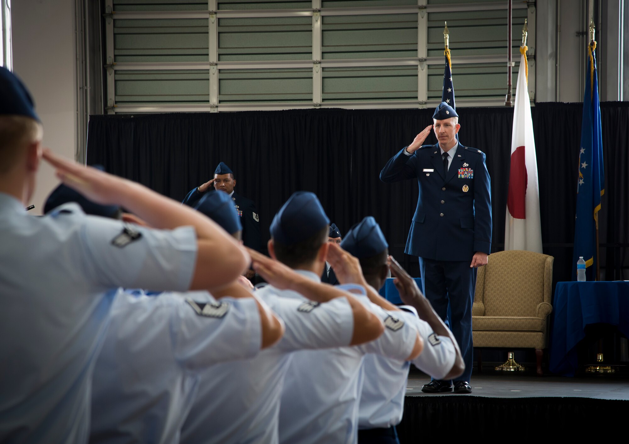 YOKOTA AIR BASE, Japan -- Lt. Col. Christoff Gaub, 374th Civil Engineer Squadron commander, salutes members of his squadron for the first time during the 374 CES change of command ceremony July 30, 2012, at Yokota Air Base, Japan. The tradition of the military salute can be traced back to medieval knights raising their visors when passing their superiors. This age-old gesture is a universal symbol of mutual respect. (U.S. Air Force photo by Tech. Sgt. Samuel Morse)
