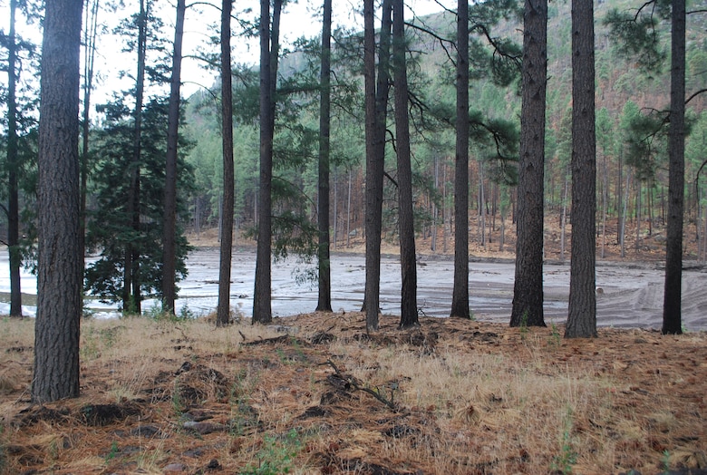 The Santa Clara Pueblo in New Mexico has four fishing ponds that became flood control structures, although they were never meant to be. The surrounding area was heavily burned by the Las Conchas Fire, and subsequent rains brought debris down the canyon and toward the Pueblo. The ponds caught much of the debris and were significantly damaged by the floods and are now considered hazards. The Pueblo has requested technical assistance from the Corps for the myriad problems they are facing, which includes the consideration of a controlled breach of the ponds.