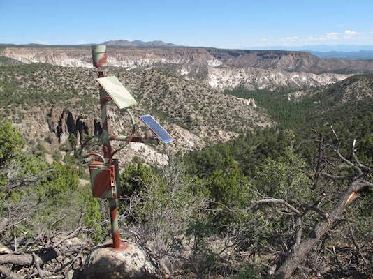 The tipping bucket rain gauge the Corps installed in Peralta Canyon is shown here. The gauge reports local precipitation amounts.