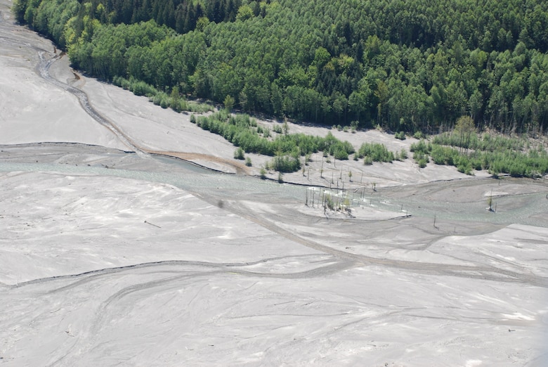 Upstream of the Sediment Retention Stream at Mount St. Helens, Wash., lies a sediment plane through which the North Fork Toutle River flows.