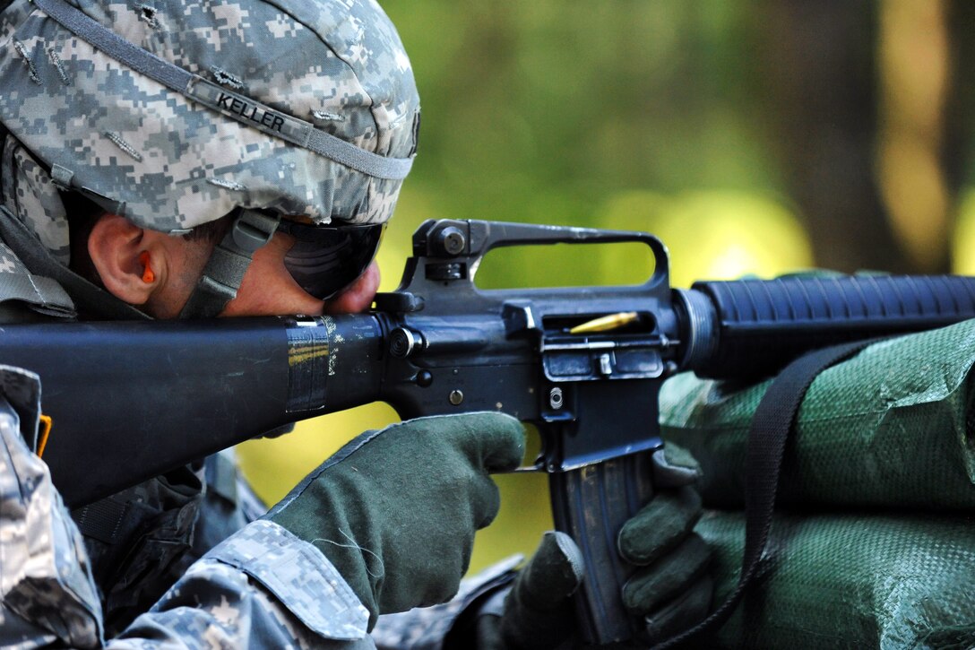 U.S. Army 1st Lt. Brian Keller fires his M16 rifle during U.S. Army Europe's Best Junior Officer Competition in Grafenwoehr, Germany, July 24, 2012. Keller is assigned to the 212th Combat Support Hospital.