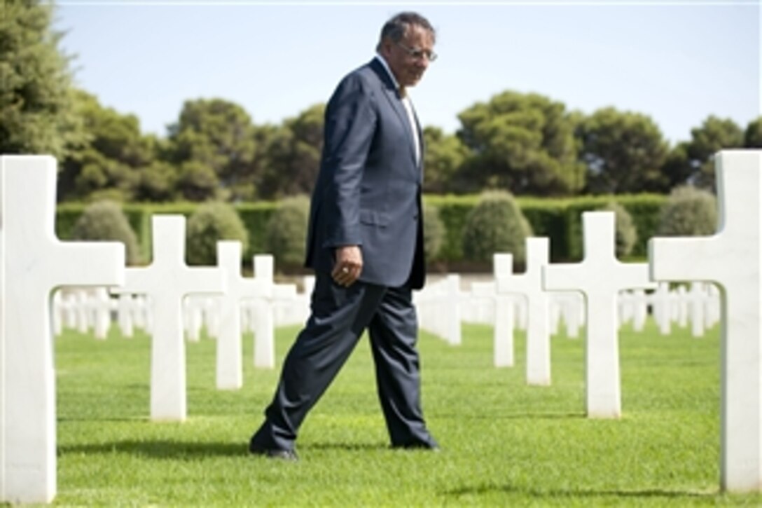 Secretary of Defense Leon E. Panetta walks through the North Africa American Military Cemetery in Tunis, Tunisia, on July 30, 2012.  Panetta is on a 5-day trip to the region, stopping in Tunisia, Egypt, Israel and Jordan to meet with senior leaders and counterparts.  