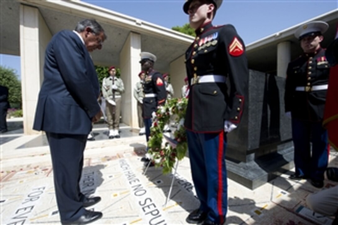 Secretary of Defense Leon E. Panetta bows his head after laying a wreath at the North Africa American Military Cemetery in Tunis, Tunisia, July 30, 2012.  Panetta is on a 5-day trip to the region, stopping in Tunisia, Egypt, Israel and Jordan to meet with senior leaders and counterparts.  