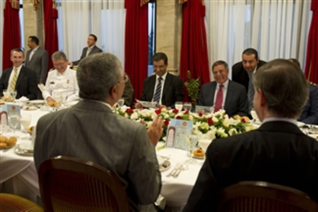 Secretary of Defense Leon E. Panetta, second from right, participates in an Iftar dinner with his host Tunisian Minister of National Defense Abdelkrim Zbidi in Tunis, Tunisia, on July 30, 2012.  Panetta is on a 5-day trip to the region, stopping in Tunisia, Egypt, Israel and Jordan to meet with senior leaders and counterparts.  
