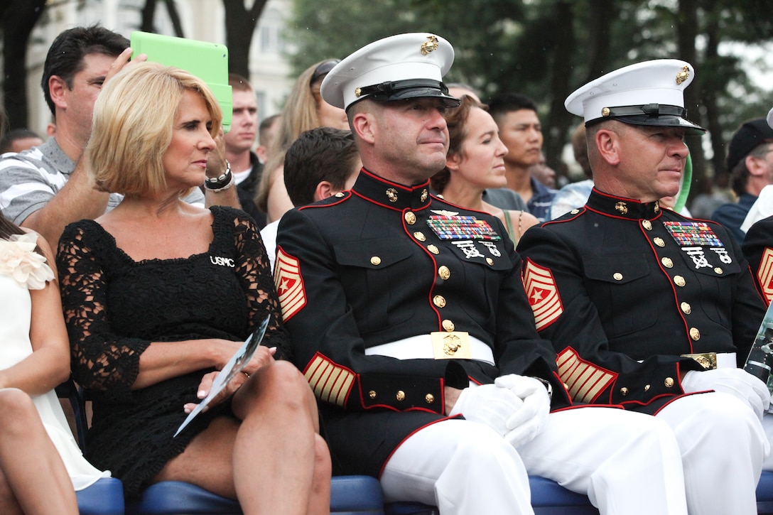 Sgt. Maj. Micheal P. Barrett, the 17th Sergeant Major of the Marine Corps; Shaon Berry, the CEO of Junior Rank; and attendees of the 2012 Sergeant Major of the Marine Corps Symposium attend the Sunset Parade at the Marine Corps War Memorial, Arlington, Va., July 31, 2012.
