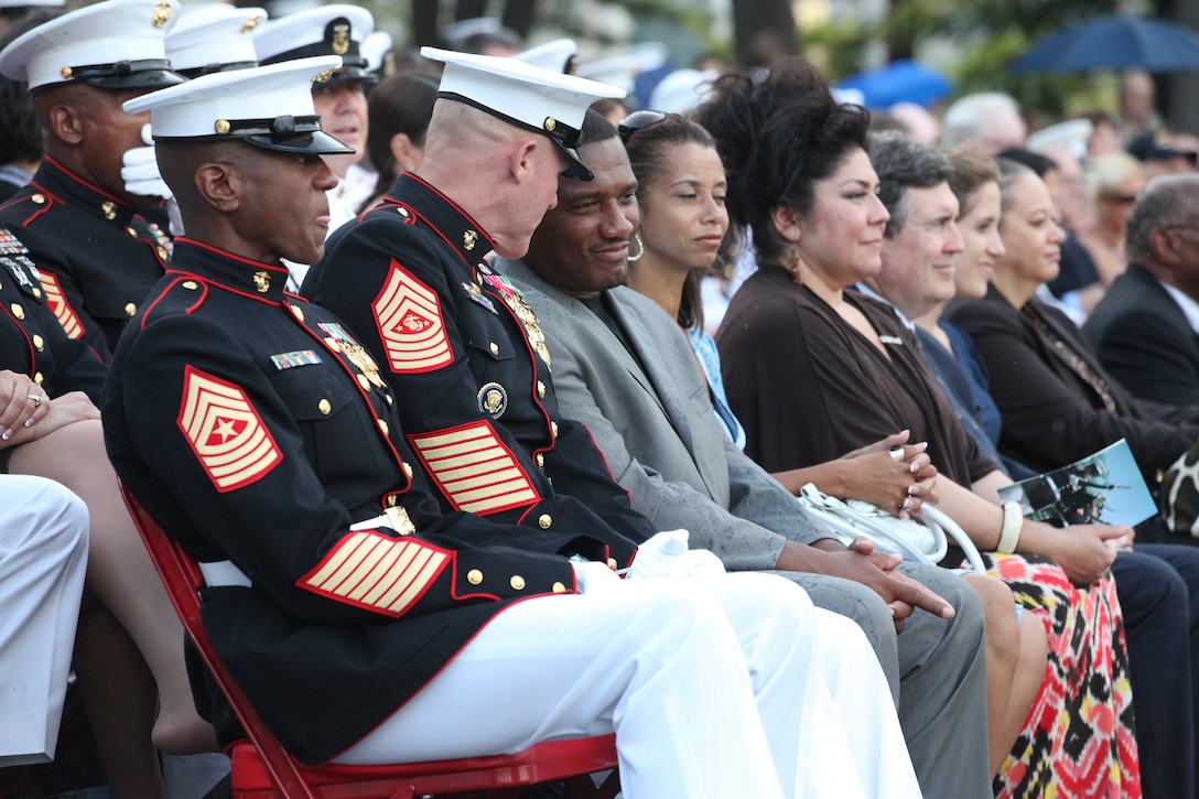 Sgt. Maj. Micheal P. Barrett, the 17th Sergeant Major of the Marine Corps; Shaon Berry, the CEO of Junior Rank; and attendees of the 2012 Sergeant Major of the Marine Corps Symposium attend the Sunset Parade at the Marine Corps War Memorial, Arlington, Va., July 31, 2012.
