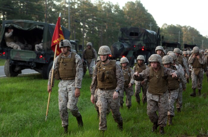 Marines and sailors with Headquarters and Service Company, Combat Logistics Regiment 27, 2nd Marine Logistics Group participate in an eight-mile hike aboard Camp Lejeune, N.C., June 1, 2012.  The purpose of the exercise was to improve the physical fitness and mental toughness of the troops within the command.