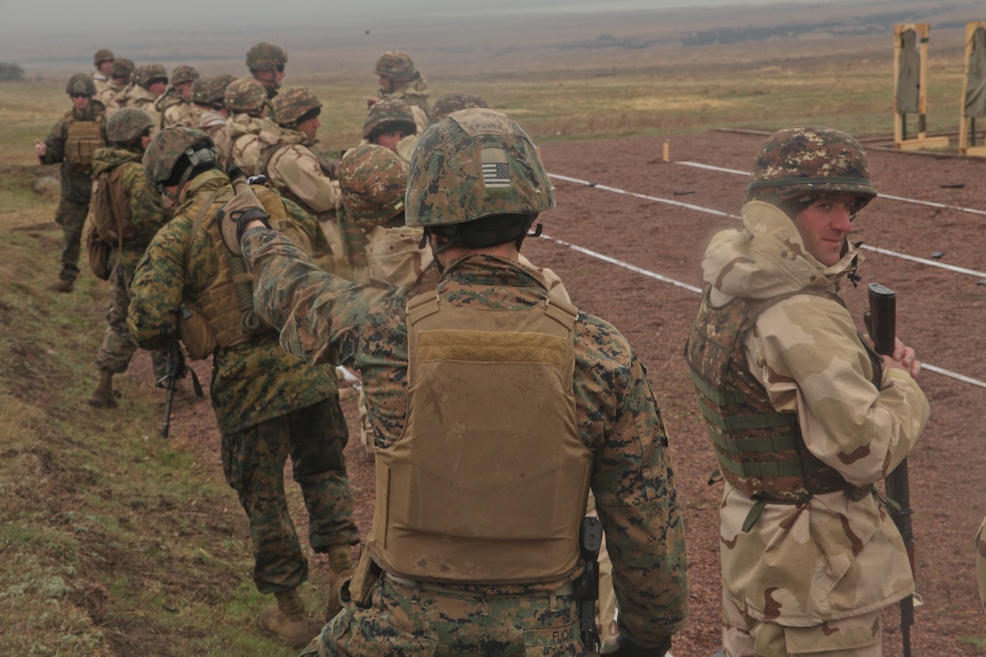 A Marine with Black Sea Rotational Force 12 gives the thumbs up signifying the Armenian soldiers on his side of the range are done firing on Babadag Training Area. Soldiers from Armenia and Macedonia trained on multiple live-fire ranges with U.S. Marines from Black Sea Rotational Force 12 during the nine-day training.::r::::n::