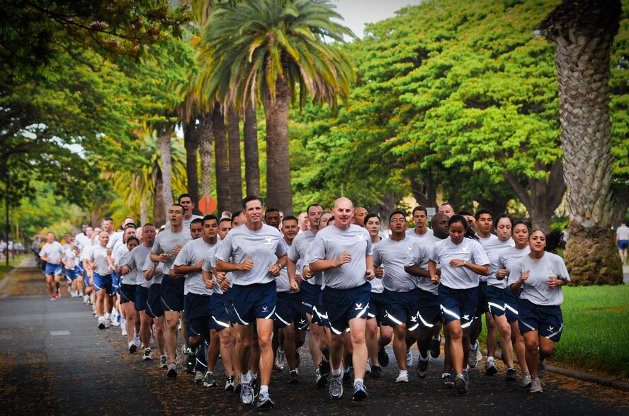 Col. Sam Barrett, 15th Wing commander, leads a formation of 15th Wing Airmen during the monthly Warrior Run June 1 at Joint Base Pearl Harbor-Hickam, Hawaii. While the Warrior Run takes place monthly, this run marked the final time Barrett and Col. Joe Dague, 15th Wing vice commander, would participate while occupying those positions. (U.S. Air Force photo by Senior Airman Lauren Main)
