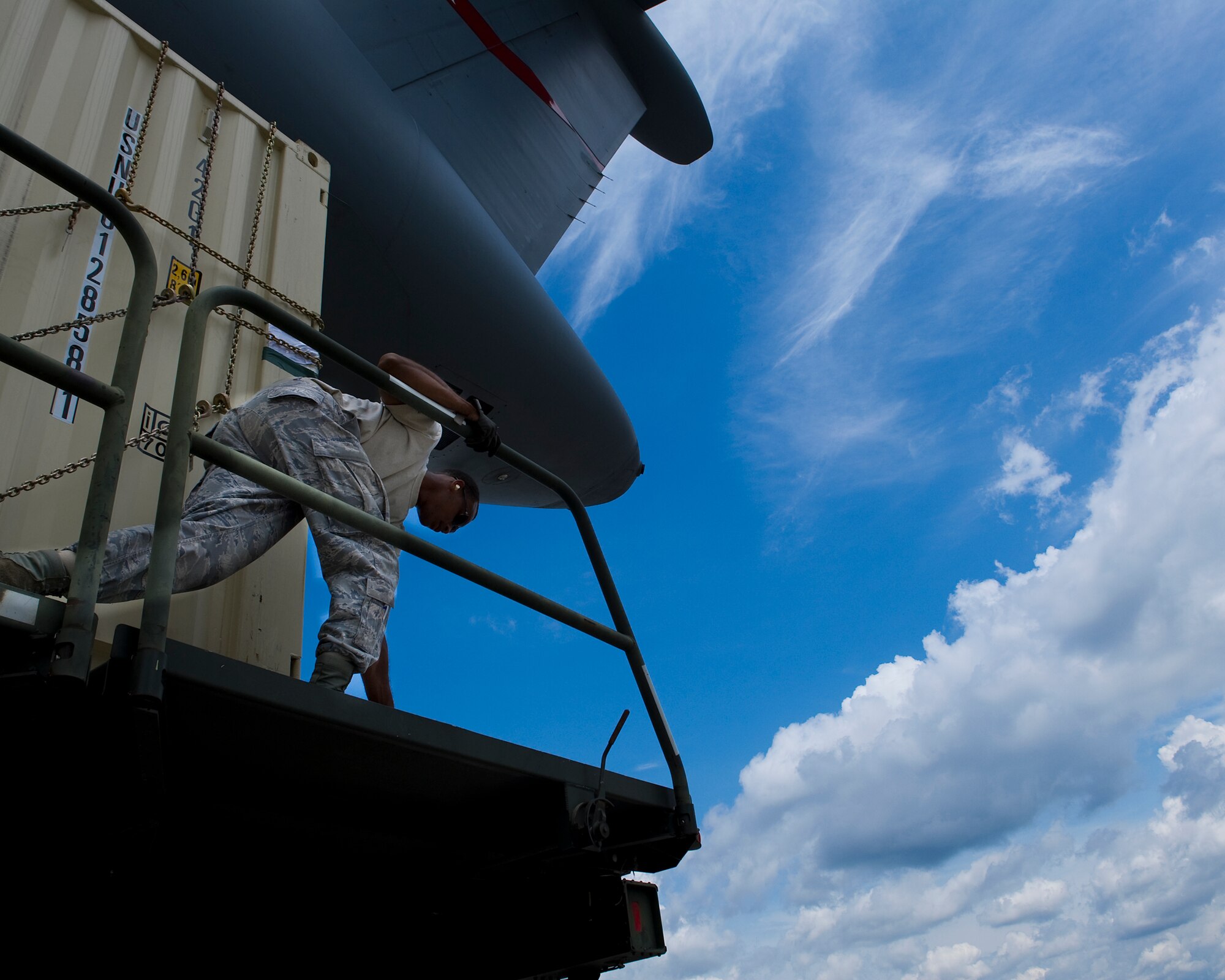A U.S. Air Force member from the 1st Special Operations Logistics Readiness Squadron releases hatches from an annex before loading it onto a C-5 Galaxy on the flightline at Hurlburt Field, Fla., June 1st, 2012. The crew loaded a total of four annexes onto the aircraft. (U.S. Air Force photo/Airman 1st Class Christopher Williams)(Released)