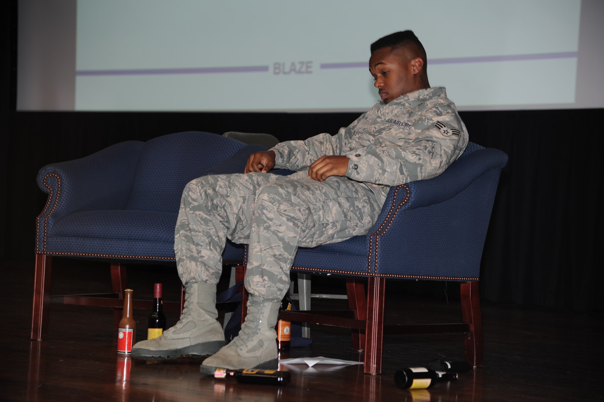 Senior Airman Parrish Cox, 14th Medical Operations Squadron plays the role of "Airman Doe" in a safety day briefing May 24 in the Kaye Auditorium.  The briefing hosted a skit that showed the struggle of Airman Doe dealing with alcohol dependence and the steps taken to break the habit.  (U.S. Air Force Photo/Airman 1st Class Charles Dickens)