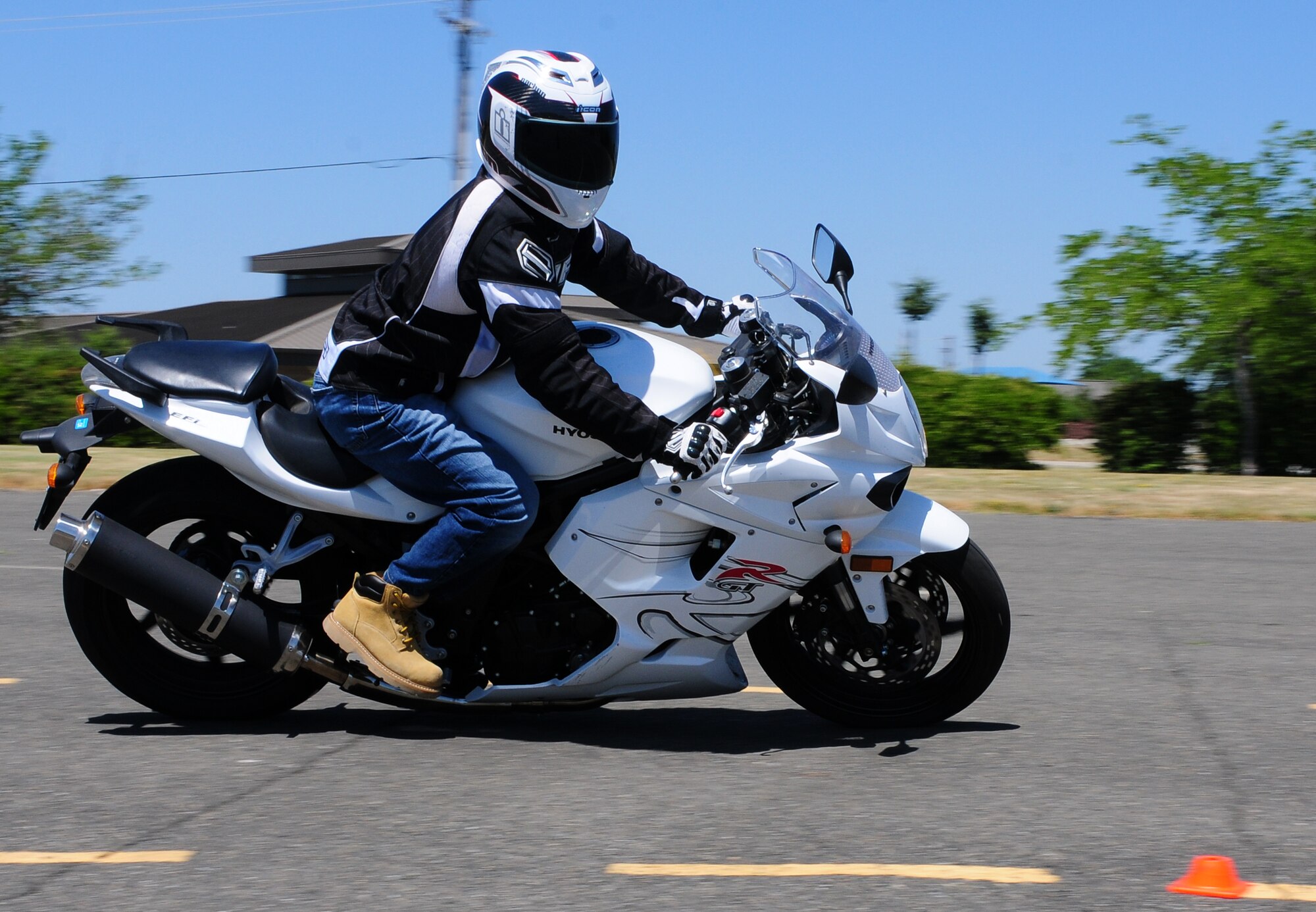 Senior Airman Jeffery Frischmon, 9th Maintenance Squadron aircraft structural technician, runs through a drill during the Basic Riders Course II at Beale Air Force Base, May 23, 2012.  This was the first time the BRC II was offered at Beale.  (U.S. Air Force photo by Senior Airman Allen Pollard/Released)