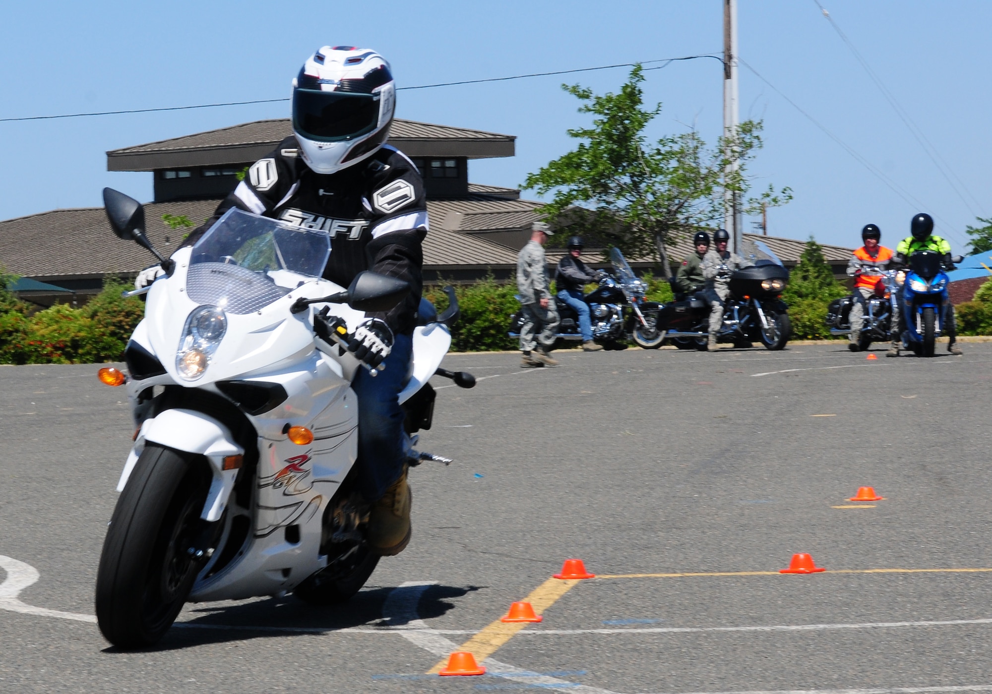 Students maneuver through a drill during the Basic Riders Course II at Beale Air Force Base, May 23, 2012. Course instructors taught students different ways to handle emergency situations.  (U.S. Air Force photo by Senior Airman Allen Pollard/Released)