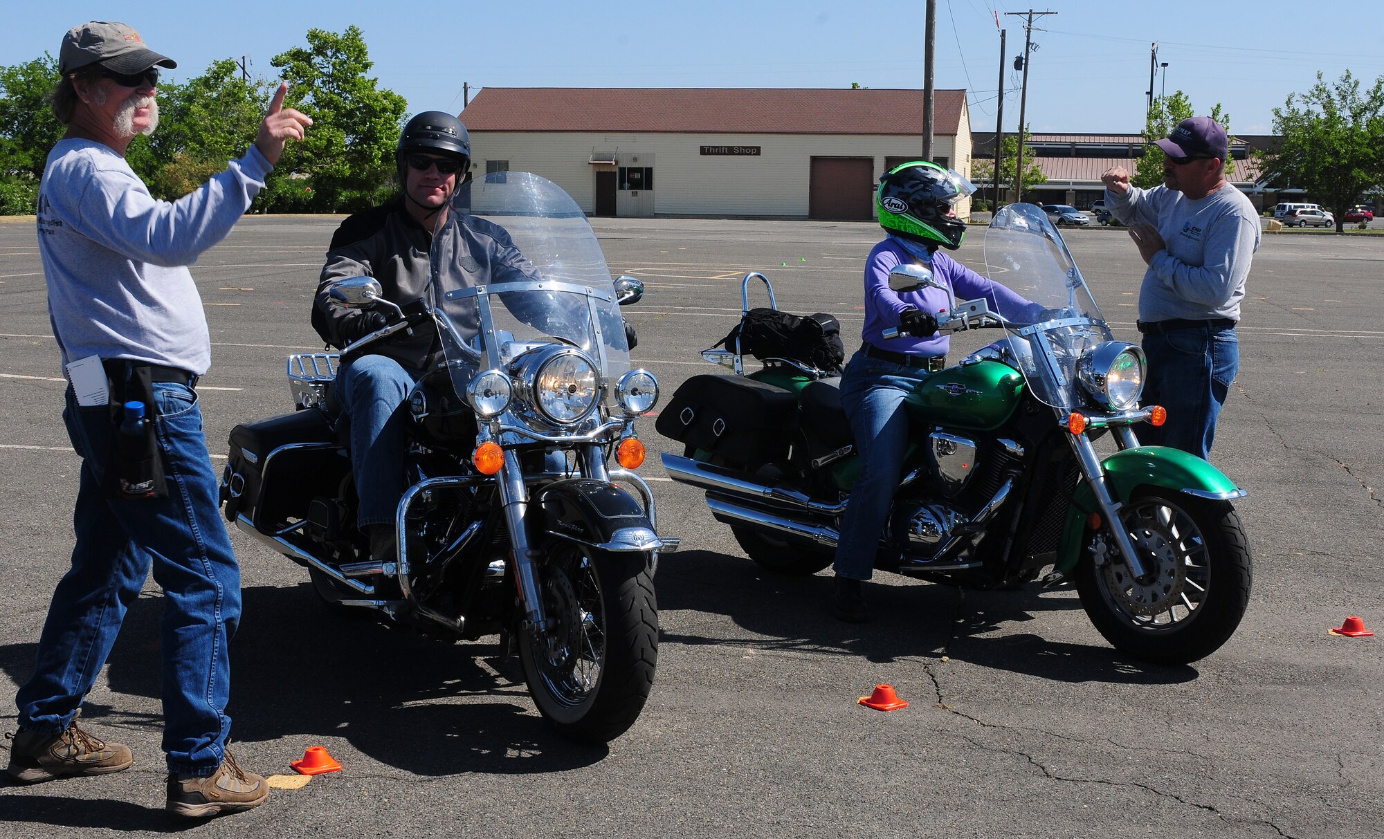 Motorcycle Safety Foundation certified rider coaches Kevin Pickerel (left) and Patrick Geronimi (right) give safety instructions to students of Basic Riders Course II at Beale Air Force Base, May 23, 2012.  The course designed by the MSF for riders who already have basic skills.  (U.S. Air Force photo by Senior Airman Allen Pollard/Released)