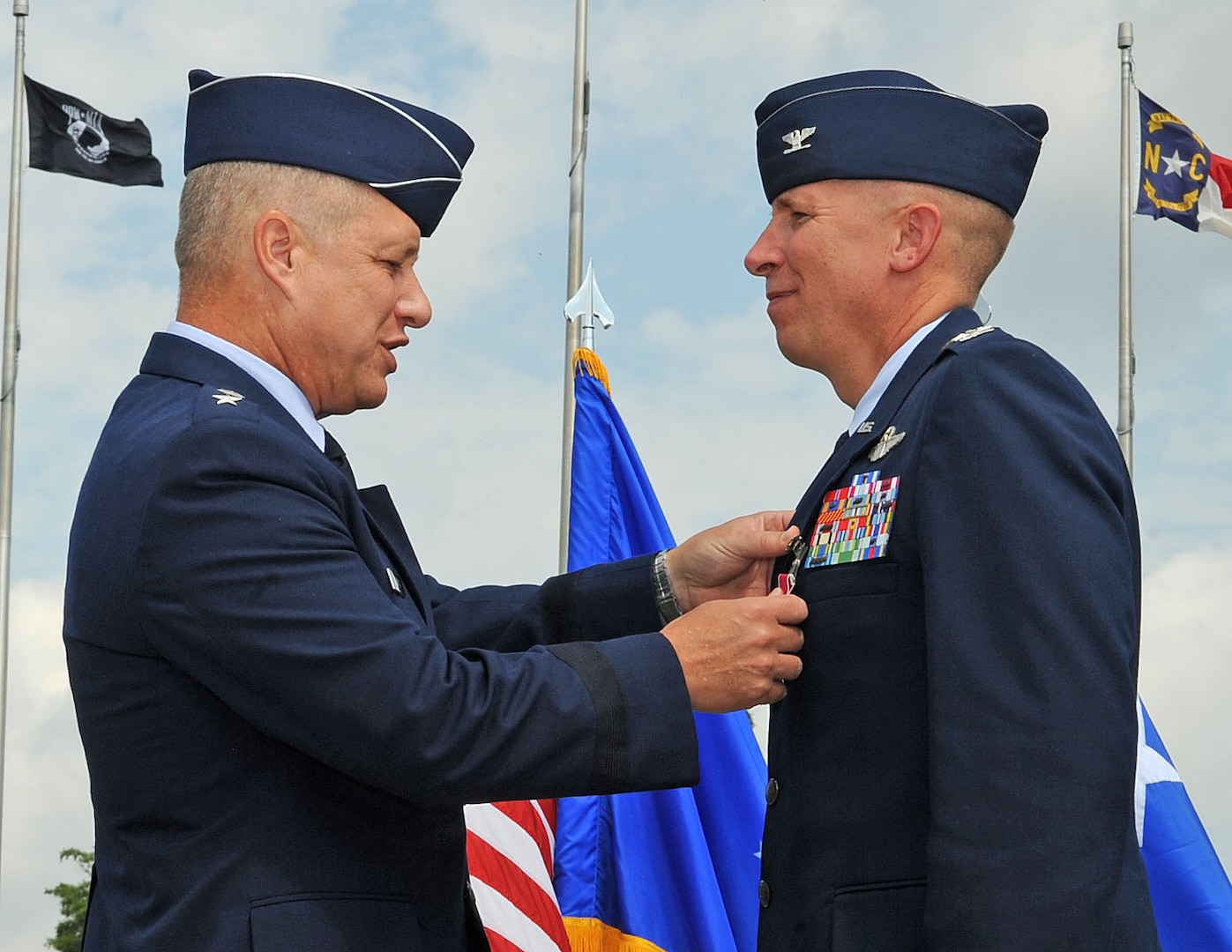 U.S. Air Force Maj. Gen. Lawrence Wells pins a Legion of Merit medal onto Col. Patrick Doherty, former 4th Fighter Wing commander during a change of command ceremony on Seymour Johnson Air Force Base, N.C., June 1, 2012. Doherty is leaving the 4th FW to become the Director of Air Force assignments at Joint Base San Antonio, Texas. Wells is the 9th Air Force commander. (U.S. Air Force photo/Airman 1st Class Aubrey Robinson/Released)