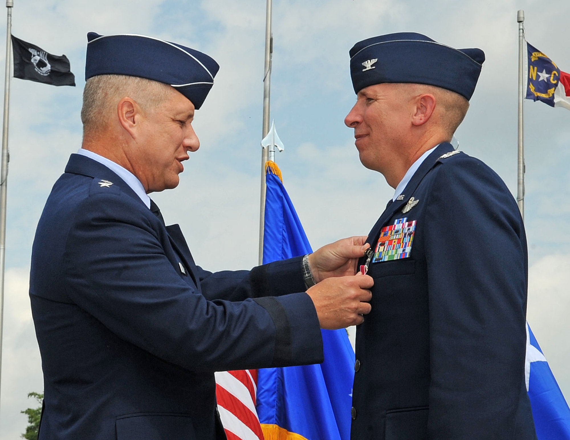 U.S. Air Force Maj. Gen. Lawrence Wells pins a Legion of Merit medal onto Col. Patrick Doherty, former 4th Fighter Wing commander during a change of command ceremony on Seymour Johnson Air Force Base, N.C., June 1, 2012. Doherty is leaving the 4th FW to become the Director of Air Force assignments at Joint Base San Antonio, Texas. Wells is the 9th Air Force commander. (U.S. Air Force photo/Airman 1st Class Aubrey Robinson/Released)