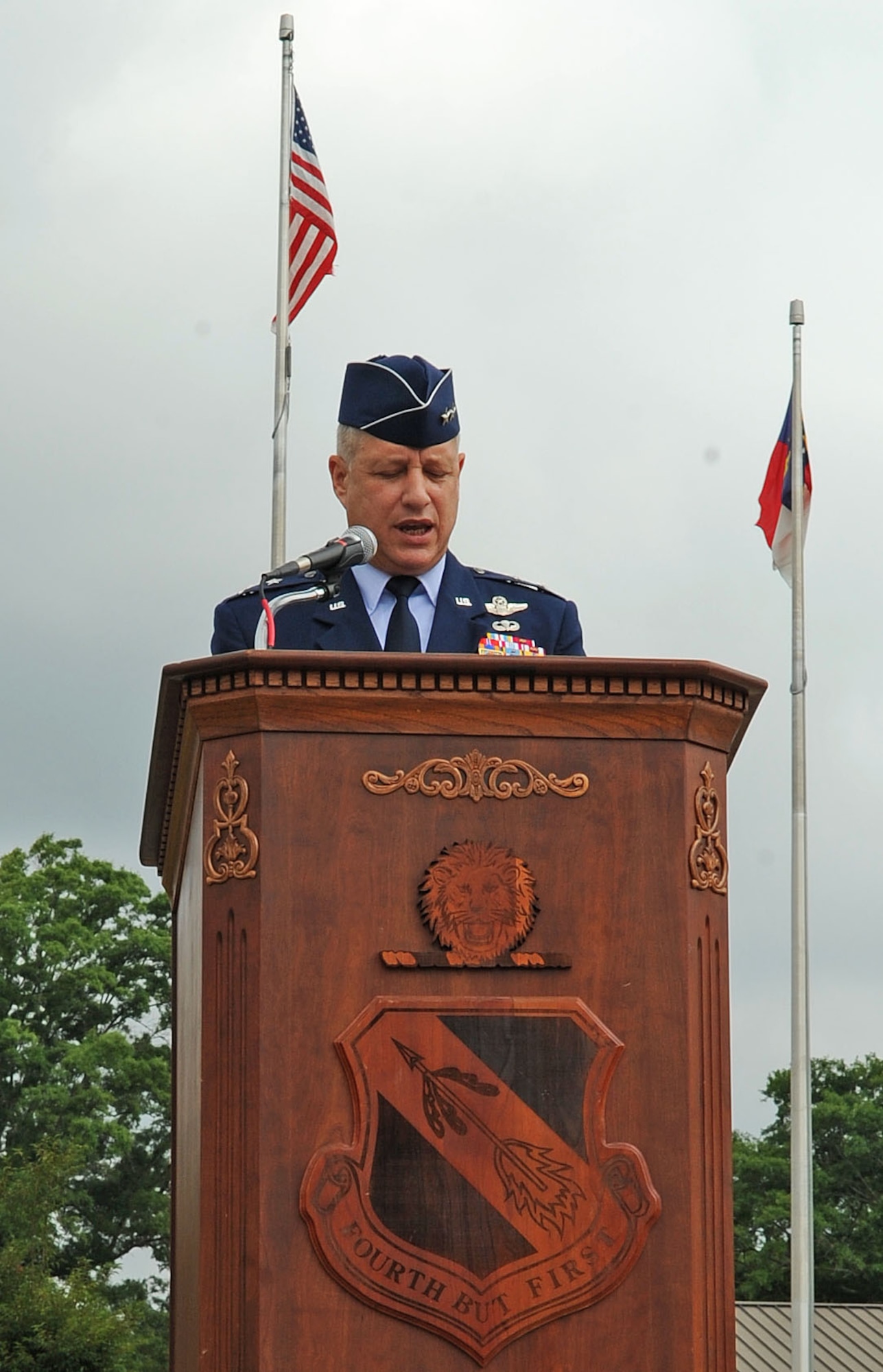 U.S. Air Force Maj. Gen. Lawrence Wells praises members of the 4th Fighter Wing on their outstanding effort and tireless commitment during the change of command ceremony on Seymour Johnson Air Force Base, N.C., June 1, 2012. Wells was the presiding official for the 4th FW change-of-command ceremony. Wells is the 9th Air Force commander. (U.S. Air Force photo/Airman 1st Class Aubrey Robinson/Released)