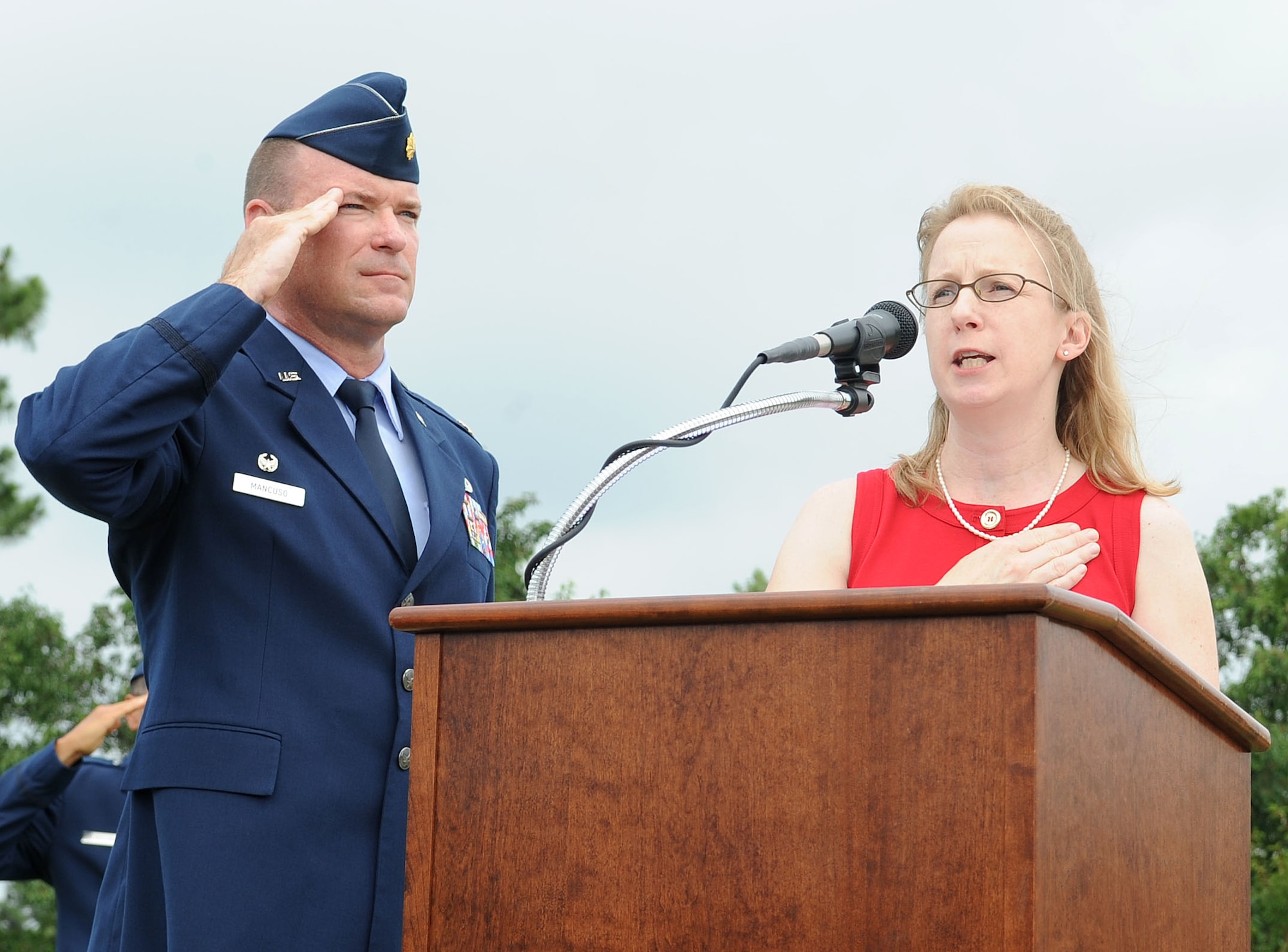 Lynn Brady-Wagner sings the National Anthem during a change of command ceremony on Seymour Johnson Air Force Base, N.C., June 1, 2012. Brady-Wagner is the cousin of U.S. Air Force Col. Jeannie Leavitt, 4th Fighter Wing commander. (U.S. Air Force photo/Airman 1st Class Aubrey Robinson/Released)