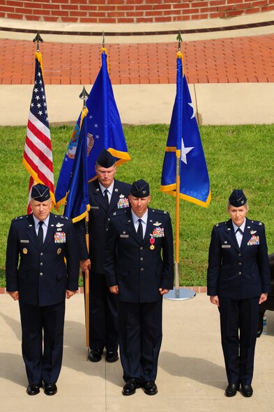 U.S. Air Force Maj. Gen. Lawrence Wells and Cols. Patrick Doherty and Jeannie Leavitt (front) along with Chief Master Sgt. Blake Malpass stand at attention during a change of command ceremony on Seymour Johnson Air Force Base, N.C., June 1, 2012. Col. Patrick Doherty relinquished command to Col. Jeannie Leavitt. (U.S. Air Force photo/Tech. Sgt. Colette Graham/Released)