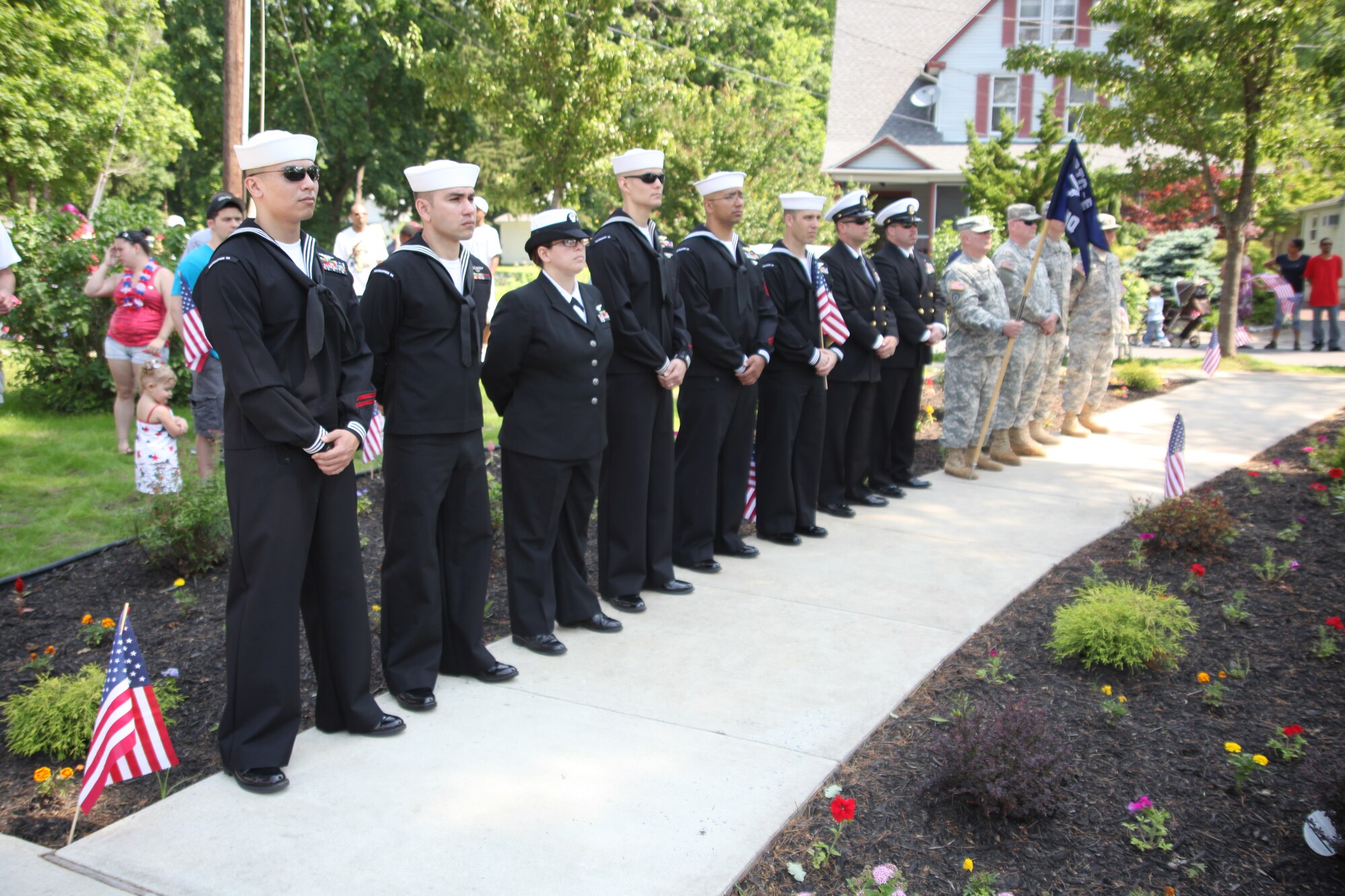 Sailors from VR-64 and VR-52 as well as Soldiers from Regional Training Center-East participate in the annual Memorial Day parade and ceremony in Browns Mills, N.J. May 28. Col. John M. Wood, Joint Base McGuire-Dix-Lakehurst commander, spoke at the event. (U.S. Air Force photo by 2nd Lt. David J. Murphy/Released)