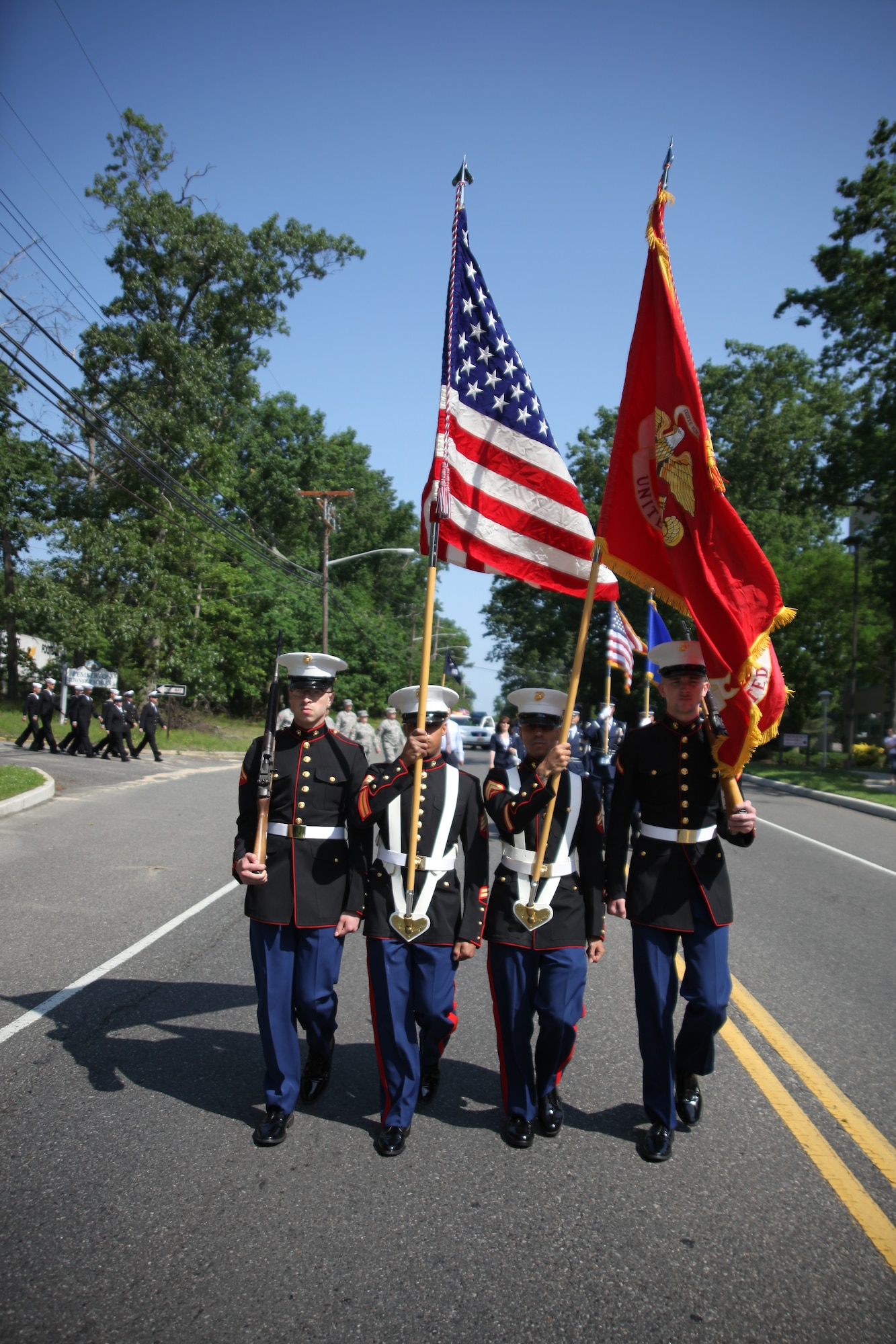 An honor guard from Marine Aircraft Group 49 leads the annual Memorial Day parade in Browns Mills, N.J. May 28. All five services were represented in this parade. (U.S. Air Force photo by 2nd Lt. David J. Murphy/Released).