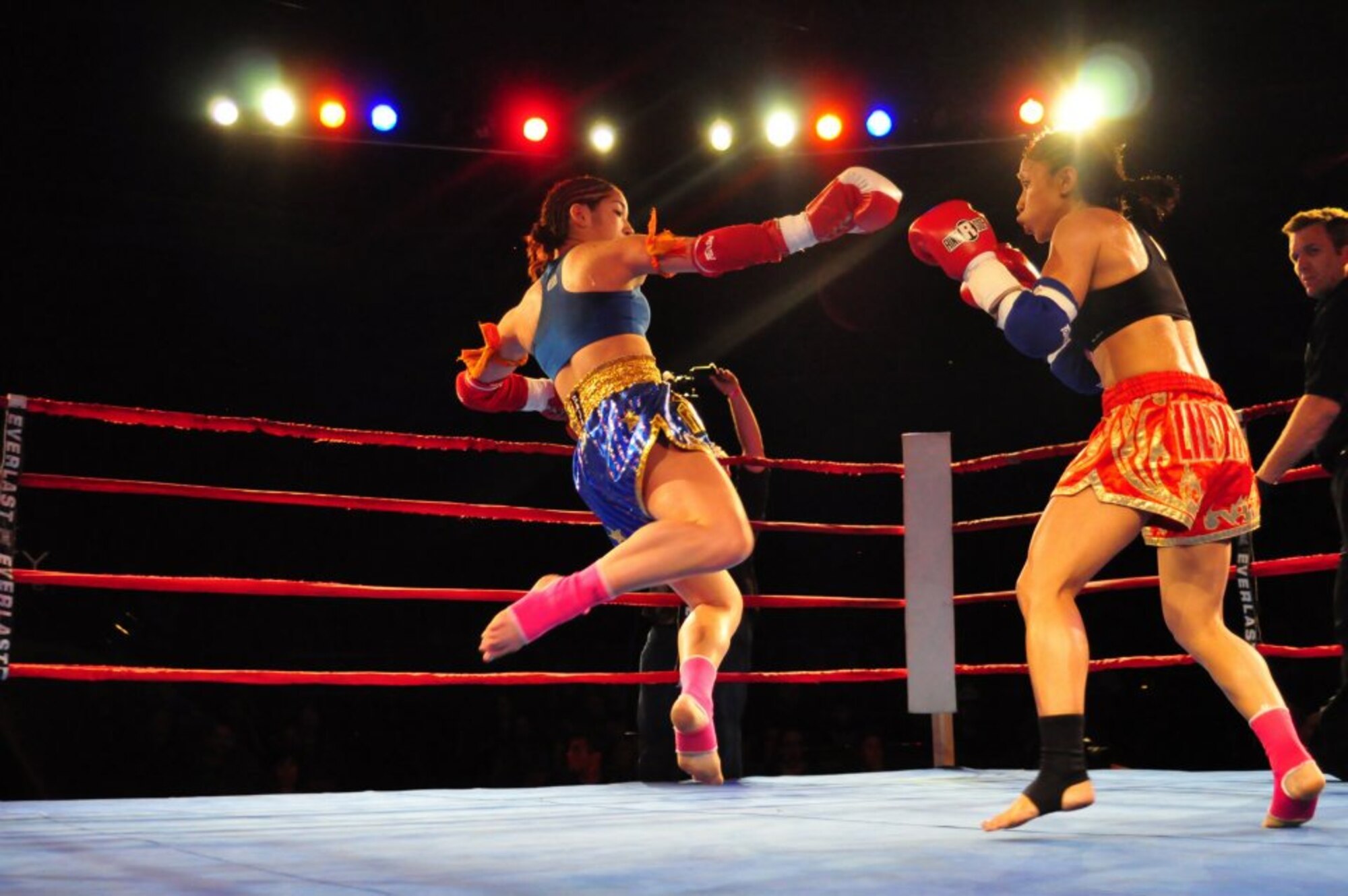 Athena Austin, daughter of retired Master Sgt. Steven Austin, 56th Maintenance Group load crew member, performs a jump kick during the 4th round of the Muay Thai Atom weight championship April 17 at Celebrity Theatre. Austin won the championship in five rounds by a unanimous decision.  (Courtesy photo)
