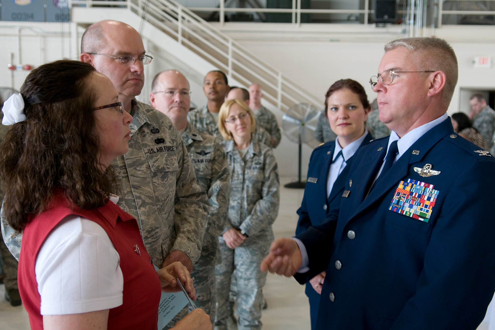 GRISSOM AIR RESERVE BASE, Ind. -- Pamie Yeager and Master Sgt. Kevin Yeager talk with Col. Donald Buckley, the new 434th Air Refueling Wing commander, in a receiving line shortly after he took command of the unit in a special ceremony here May 19. Mrs. Yeager is the 434th ARW commander?s secretary and Sergeant Yeager is a knowledge operations manager with the 434th Mission Support Group. (U.S. Air Force photo/Tech. Sgt. Mark R. W. Orders-Woempner)

