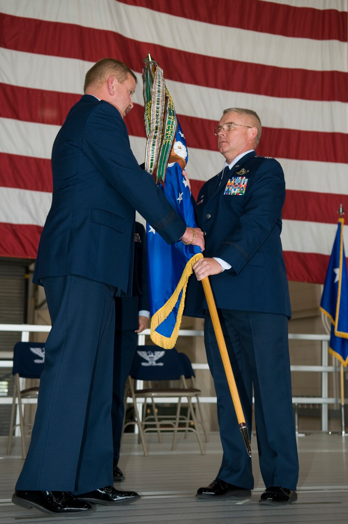 GRISSOM AIR RESERVE BASE, Ind. -- Maj. Gen. Mark Kyle, left, presents the 434th Air Refueling Wing flag to Col. Donald Buckley as the colonel takes command of the unit during a special change of command ceremony here May 19. Kyle is the 4th Air Force commander and presided over the ceremony. (U.S. Air Force photo/Tech. Sgt. Mark R. W. Orders-Woempner)