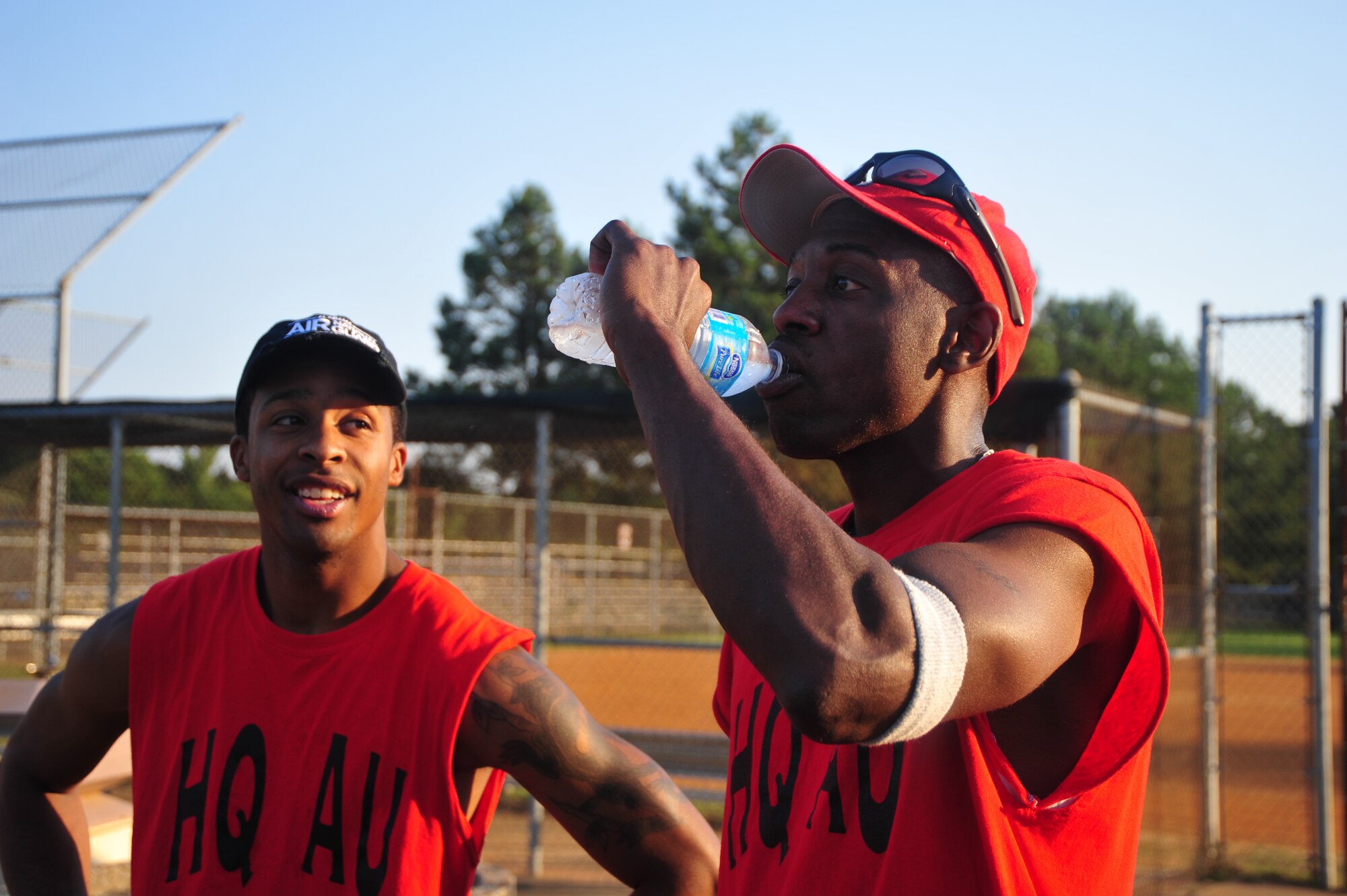 Senior Amn. LaDarius Reed, 187 Fighter Wing, Force Support Squadron, Customer Service Representative and Master Sgt. Tony Mathews, 187 Fighter Wing, Knowledge Operations Manager, staying hydrated during their intramural softball game. Proper hydration is key to preventing accidents in the Alabama summer heat.  (U.S. Air Force photo by Airman 1st Class William Blankenship)