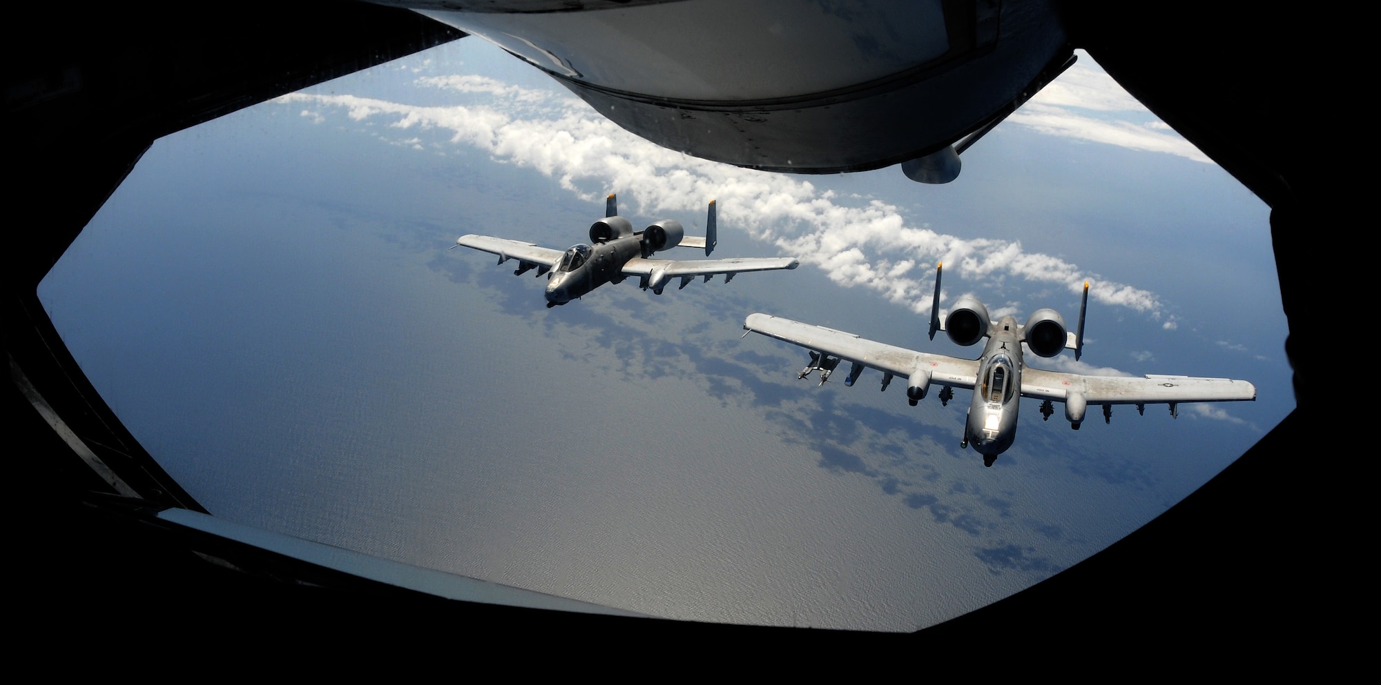 SWEDISH AIR SPACE -- Two A-10 Thunderbolt II aircraft, call signs Growler 11 and 12 from Spangdahlem Air Base, Germany, fly in formation in Swedish air space behind a 100th Air Refueling Wing KC-135 Stratotanker after receiving fuel during the Baltic Region Training Event XII May 30, 2012. BRTE XII was a NATO exercise that included support from several countries including the United States, France, Estonia and Latvia. (U.S. Air Force photo/Staff Sgt. Thomas Trower) 