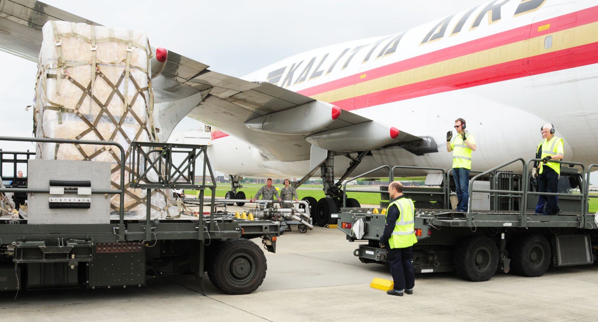 RAF MILDENHALL, England – Air-freight handlers from the 727th Air Mobility Squadron Ramp Services flight load cargo onto an aircraft here May 31, 2012. The 727th AMS is the single point of entry for all military cargo and passengers entering the United Kingdom. The ramp services team handles with high-priority cargo such as aircraft parts, blood, mail and other high-interest items, as well as household goods. Though delivered by local contractors, about 30 to 40 percent of household goods are delivered by air, and are dealt with by the ramp services flight. (U.S. Air Force photo/Karen Abeyasekere)