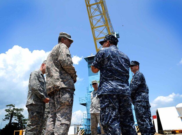 Army Lt. Gen. Vincent Brooks, Third Army commanding general, is briefed by Chief Warrant Officer 3 John Wilson, 628th Logistics Readiness Squadron, at Wharf Alpha May 23, 2012 at Joint Base Charleston – Weapons Station. Brooks visited JB Charleston to get a first-hand look at the military functions that are unique to this base. (U.S. Air Force photo/Airman 1st Class Ashlee Galloway)