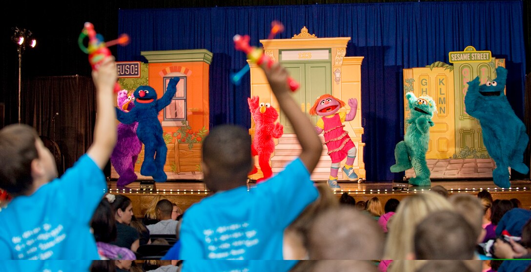 The Sesame Street cast performs center stage at the Reel Time Base Theater on May 21.  Joint Base Andrews families and their children were treated to a 30-minute show by the full cast on May 21 and 22. The children received free hand toys and were able to interact with the Sesame Street characters for hugs and photo opportunities during the show. (Photo/Bobby Jones) 