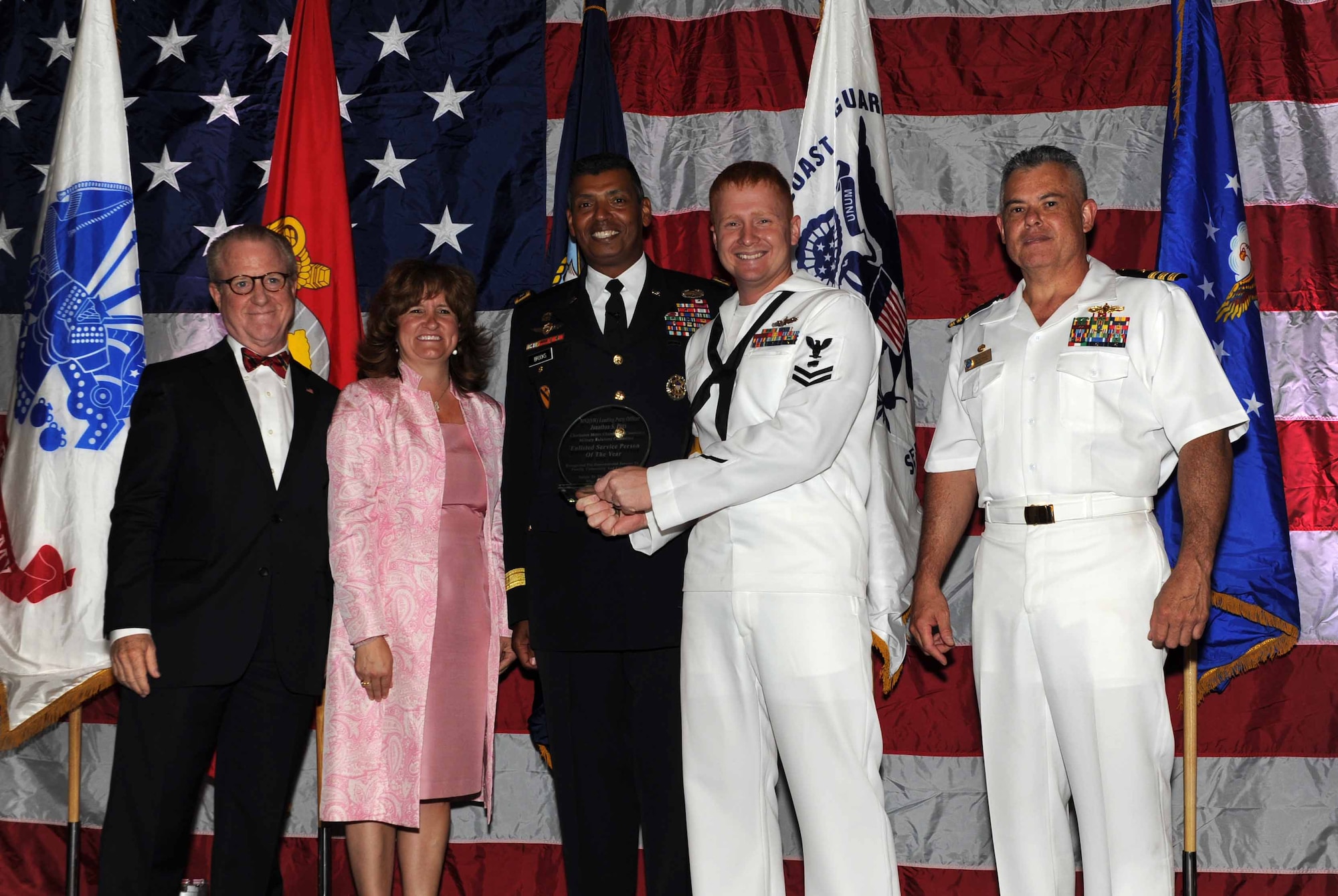 Peter Wertimer, Charleston Chamber of Military Policy council chairman, Julie Gerthoffer, Charleston Chamber of Military Relations Committee and U.S. Army Lt. Gen. Vincent Brooks, Third Army commanding general, present Petty Officer Jonathan Pitts, a Mineman and Leading Petty Officer Magazine/Field Crew, the'Enlisted Service Person of the Year' award, alongside his commanding officer, CDR Charles Phillip, Naval Munitons Command commander, during 'Salute to the Military' May 23, 2012 at the North Charleston Convention Center, S.C. This is the eighth year the Charleston Metro Chamber of Commerce recognized the local active-duty, reserve, and civilian personnel for their community service above and beyond their call of duty. (U.S. Air Force photo/Airman 1st Class Ashlee Galloway)