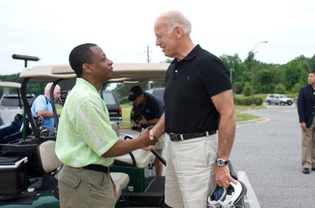 Chief Master Sgt. Anthony Brinkley, 11th Wing/Joint Base Andrews command chief, left, and Vice President Joe Biden, exchange pleasantries before a round of golf at The Courses on Andrews. Brinkley is slated to retire in a ceremony here June 8 after more than 28 years of active-duty service. (Courtesy photo)
