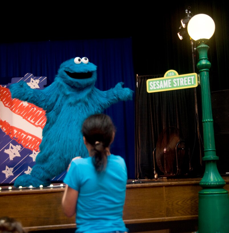 Cookie Monster takes center stage during a performance at the Reel Time Base Theater on May 21.  Joint Base Andrews families and their children were treated to 30-minute shows by the full cast May 21 and 22.  The children were able to interact with the Sesame Street characters for hugs and photo opportunities during the show. (Photo/Bobby Jones) 