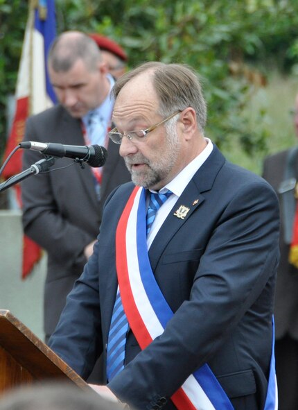 Philippe Catherine, mayor of Picauville, France, addresses attendees June 1, 2012, during a commerative ceremony honoring the Airmen and soldiers who lost their lives during the famous Normandy D-Day invasion. A memorial erected within Picauville pays tribute to Airmen of the 9th Air Force as well as 82nd and 101st Airborne paratroopers who lost their lives when their C-47 Skytrain aircraft were brought down by German anti-aircraft artillery in the early morning hours of June 6, 1944. The aircrews and paratroopers paid the ultimate sacrifice supporting the invasion. Members of the Air Force Reserve Command's 302nd, 910th and 440th Airlift Wings took part in this year's 68th Anniversary commemoration of the historic invasion. (U.S. Air Force photo/Staff Sgt. Stephen J. Collier)