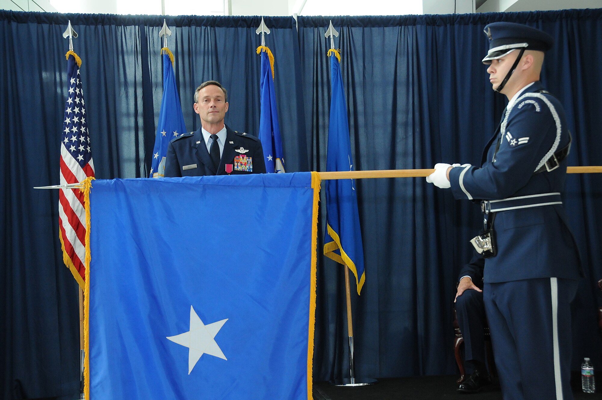 Brig. Gen. Jon Mott, Special Assistant to the Air National Guard Readiness Center commander, was presented his general officer flag during his promotion ceremony to Brigadier General, May 30, 2012 at the ANGRC, Joint Base Andrews, Md. Mott was recently appointed as the next Connecticut Air Adjutant General and is scheduled to take command of the Connecticut ANG mid-July. (National Guard photo by Tech. Sgt. Melissa E. Chatham/RELEASED)