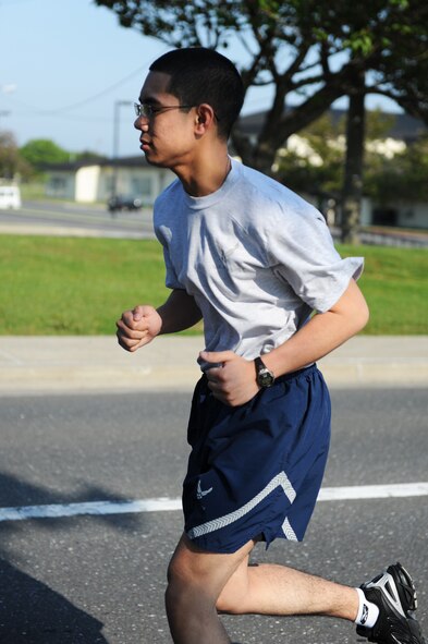 U.S. Airman 1st Class Carl Lansang, 35th Medical Support Squadron outpatient records technician, runs during the first readiness run of the year at Misawa Air Base, Japan, June 1, 2012. Sailors, Soldiers, Airmen and members of the Japan Air Self-Defense Force participated in the readiness run. (U.S. Air Force photo by Airman 1st Class Kia Atkins/Released)