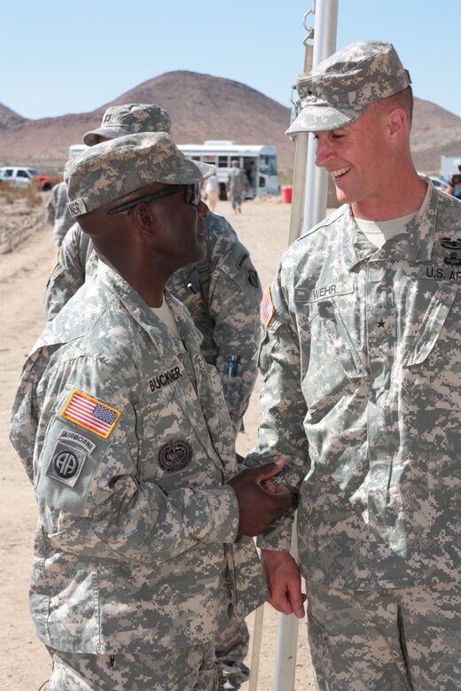 Command Sgt. Maj. Nathan Buckner (left), the command sergeant major for the National Training Center and Fort Irwin, speaks with Brig. Gen. Mike Wehr, U.S. Army Corps of Engineers South Pacific Division Commander, at the groundbreaking ceremony for the 216,000 square-foot Weed Army Community Hospital facility May 30. The USACE Los Angeles District manages the nearly $160 million project which is scheduled for completion in 2016.