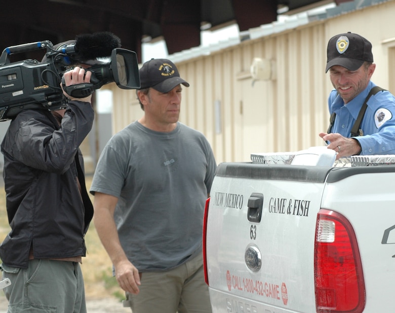 Mike Rowe, star of “Dirty Jobs,” and Shawn Denny, southeast area fisheries manager with New Mexico Department of Game and Fish, discuss fish squeezing and prepare to board the boats to capture female fish for their eggs. 