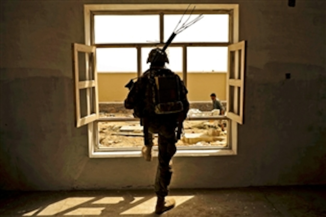 U.S. Army Pvt. Lathaniel Ulofoshio provides security while U.S. service members conduct a site survey of the Sanjaray health clinic in Kandahar, Afghanistan, May 24, 2012. Ulofoshio is assigned to the Kandahar Provincial Reconstruction Team.